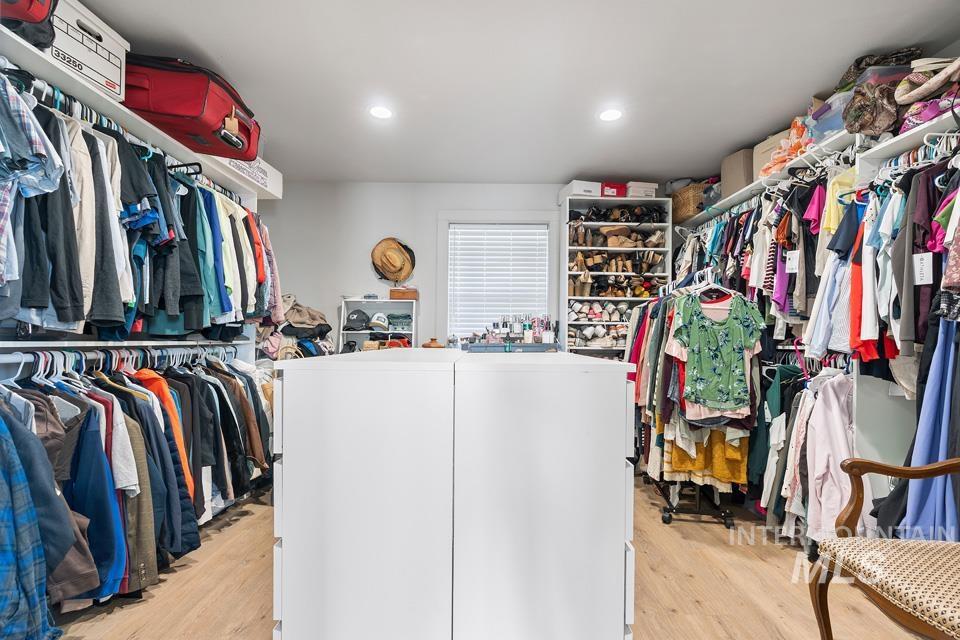 Walk in closet featuring light wood-type flooring