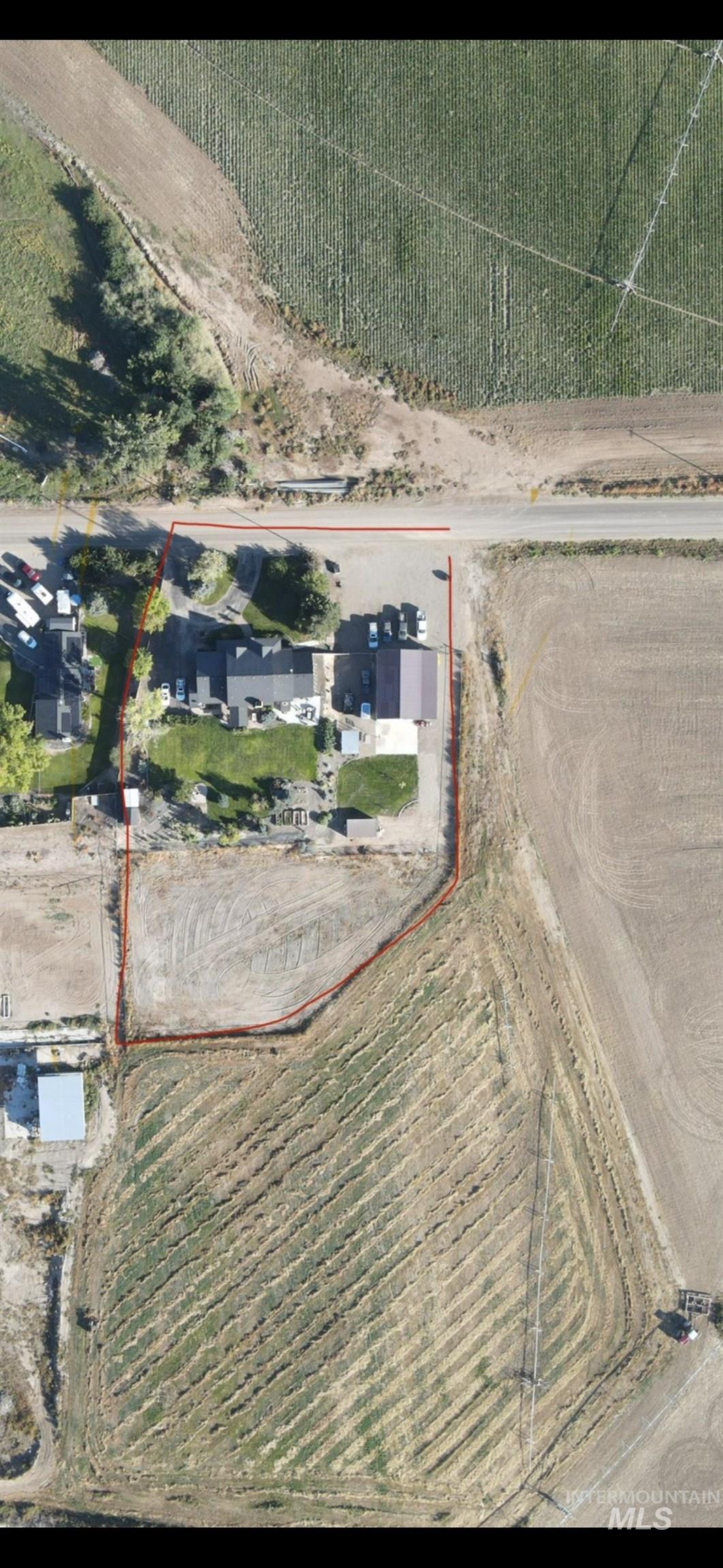 Aerial overview of property's location with property parcel outlined