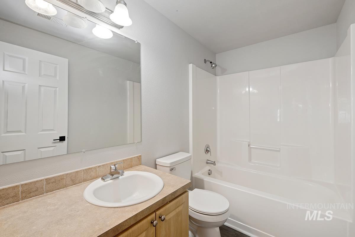 Full bath with washtub / shower combination and vanity