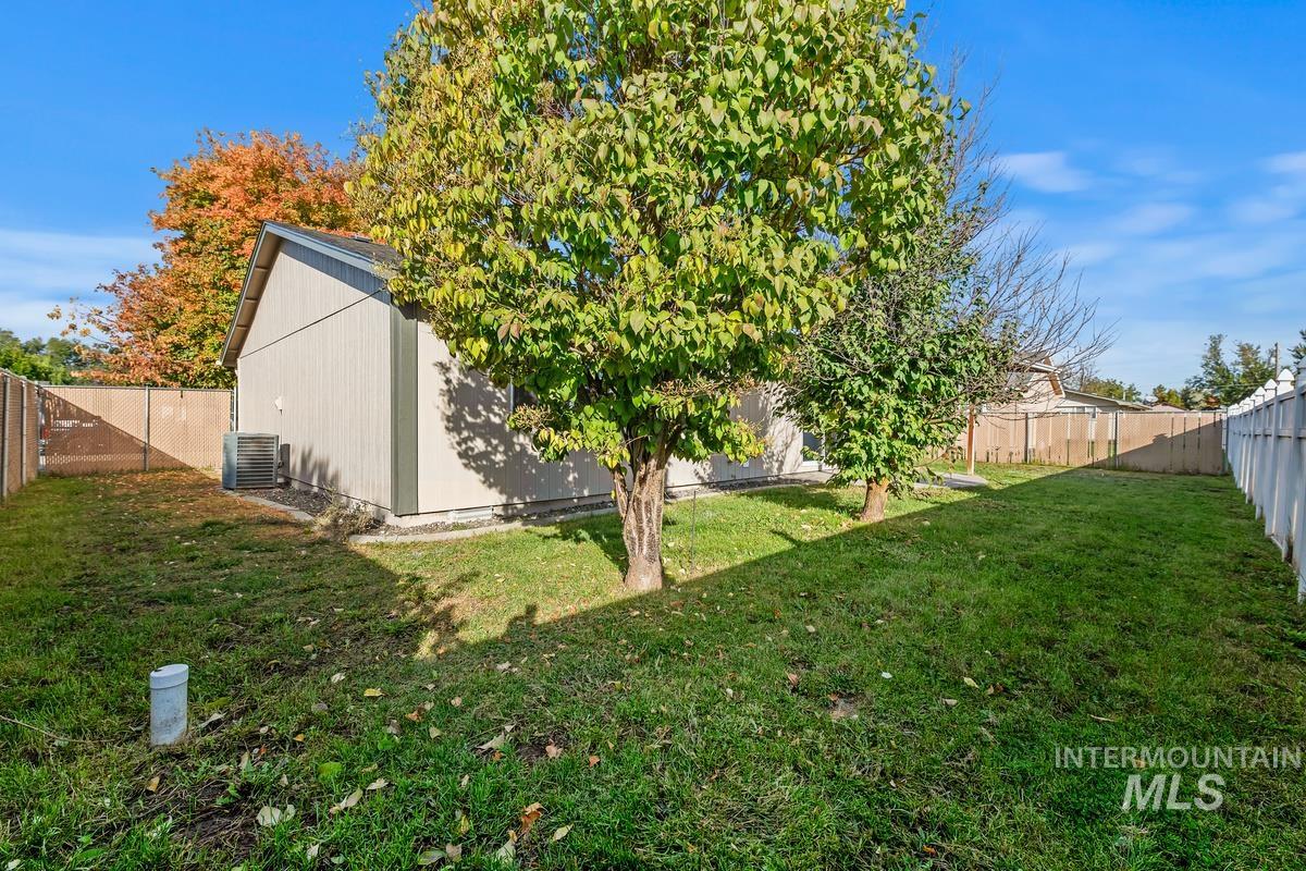 View of fenced backyard