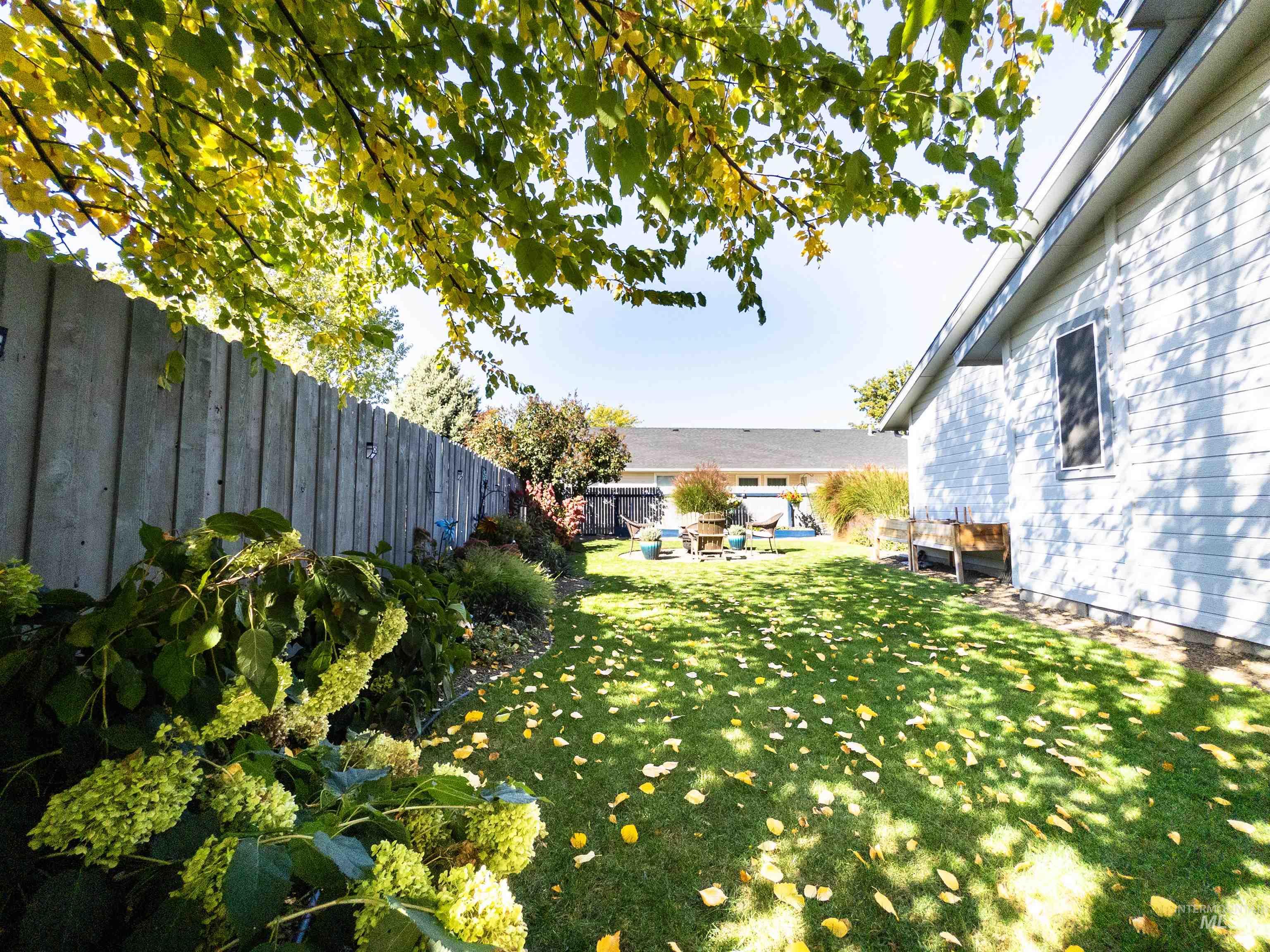 Fenced backyard with a patio