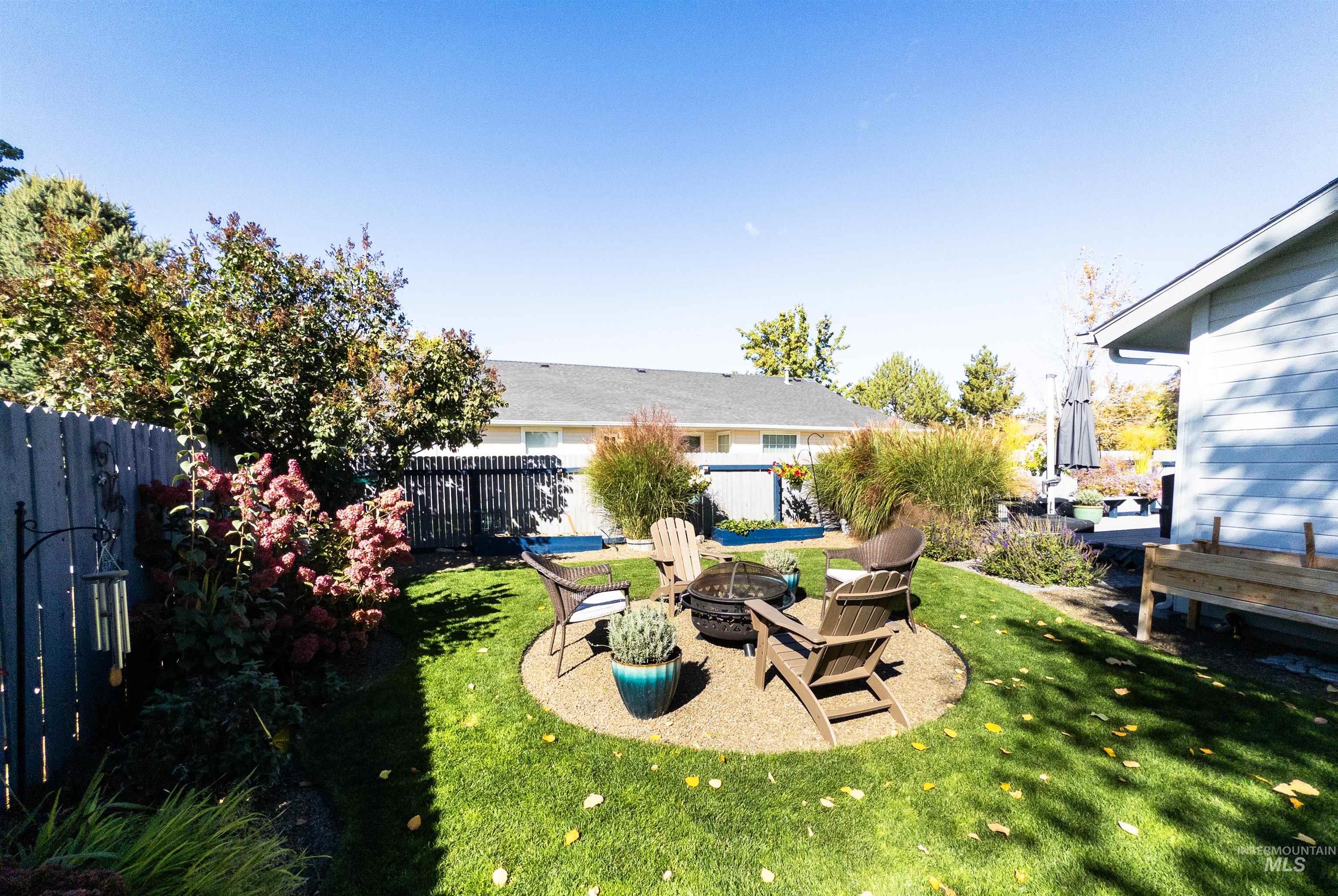 View of yard with a patio and a fire pit