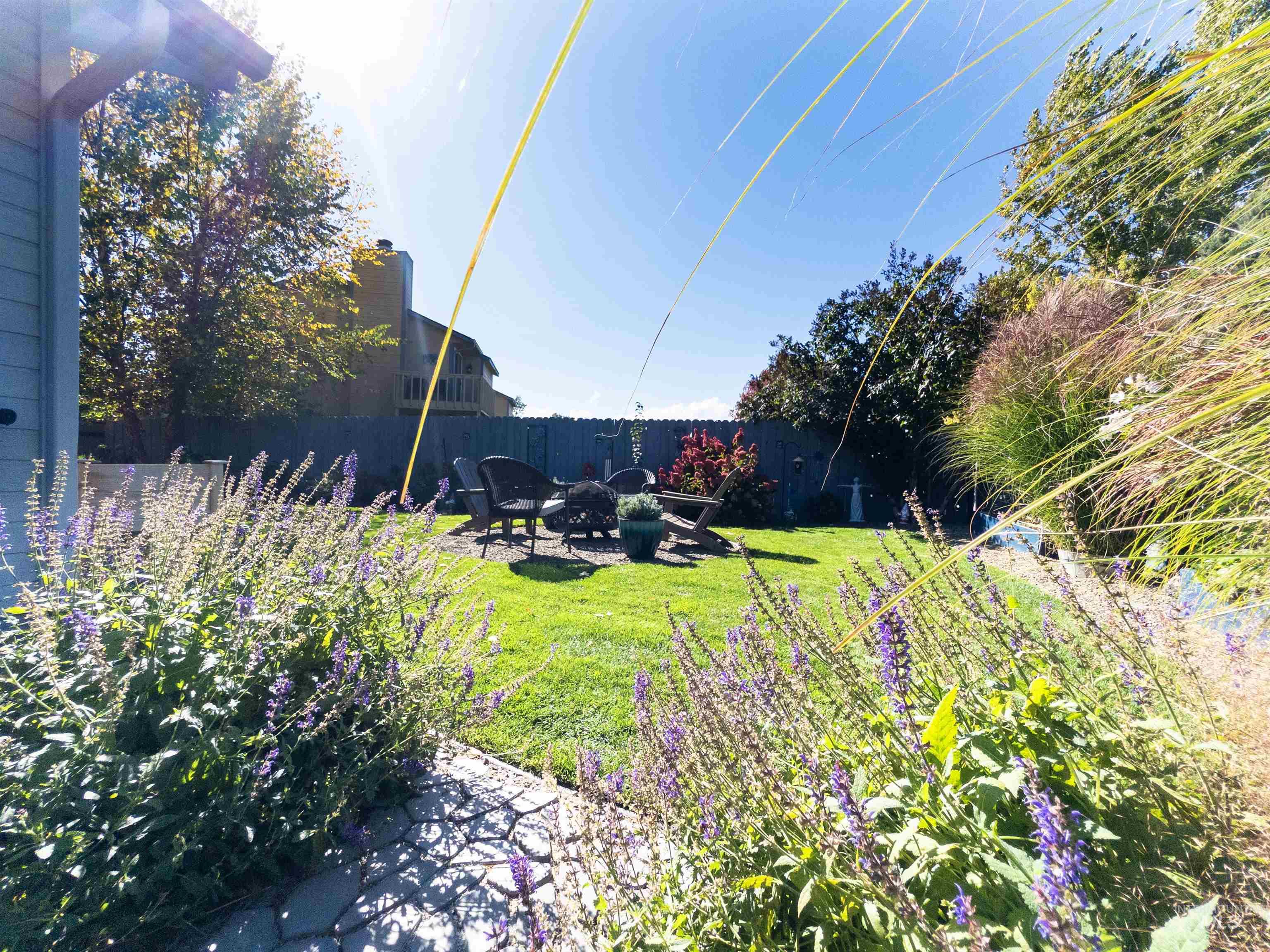 View of yard with a patio area and a fire pit