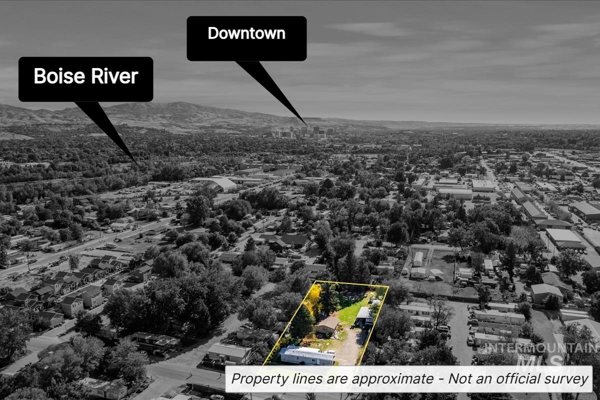 Aerial overview of property's location featuring a mountain backdrop and property boundaries highlighted