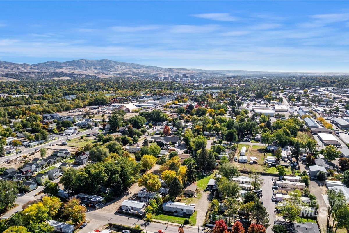 Aerial perspective of suburban area with a mountainous background