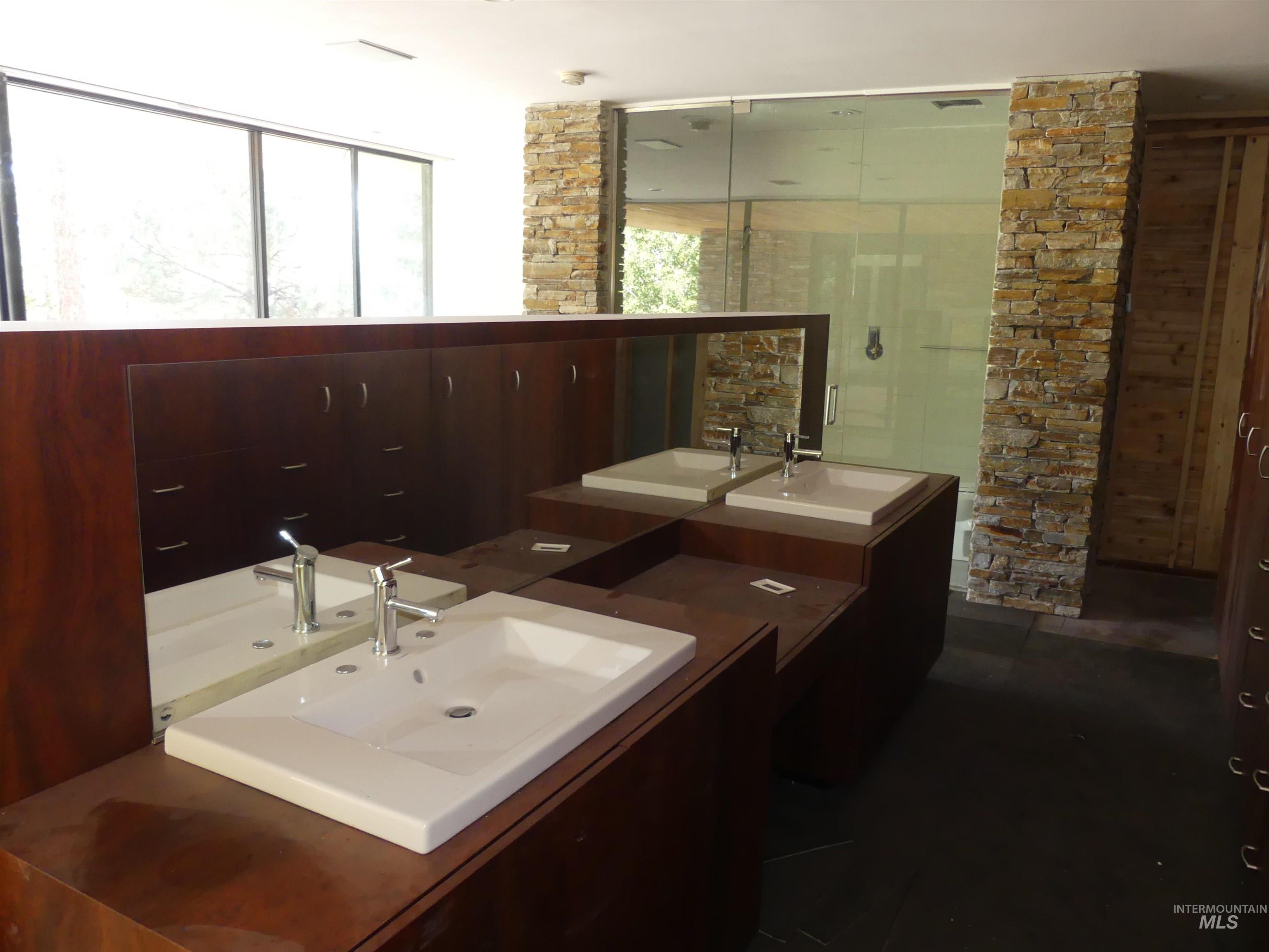 Bathroom with vanity and a shower stall