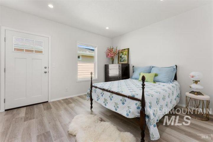 Bedroom featuring light wood finished floors and recessed lighting