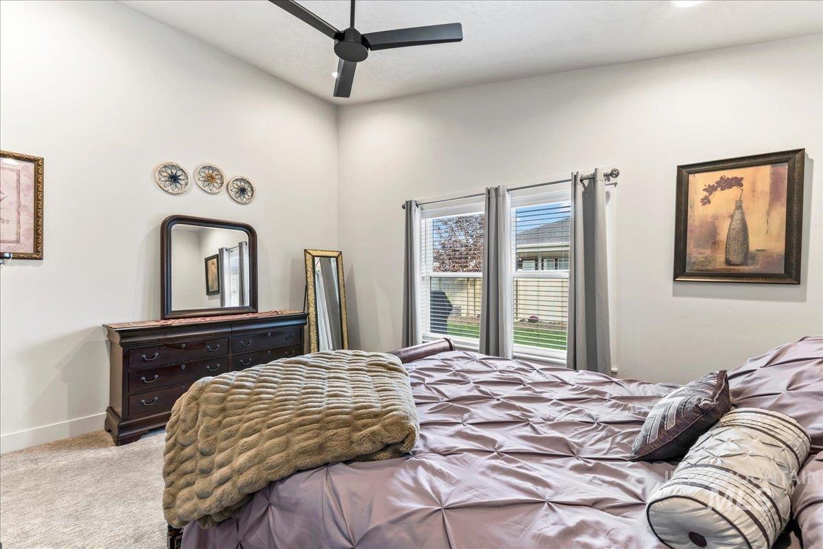 Bedroom featuring carpet floors and ceiling fan