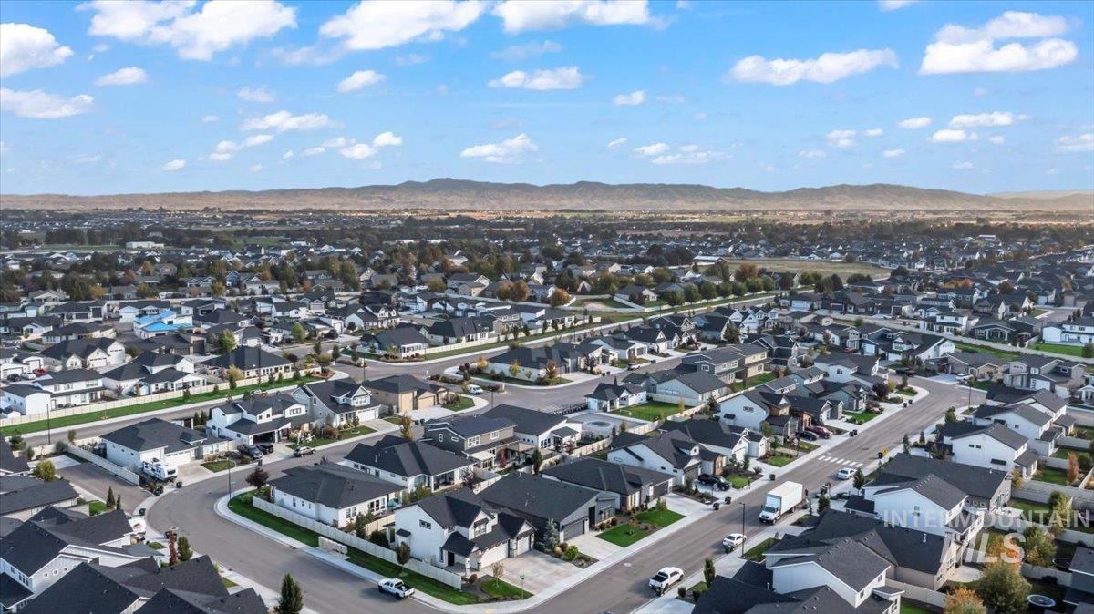 View of property location with nearby suburban area and mountains