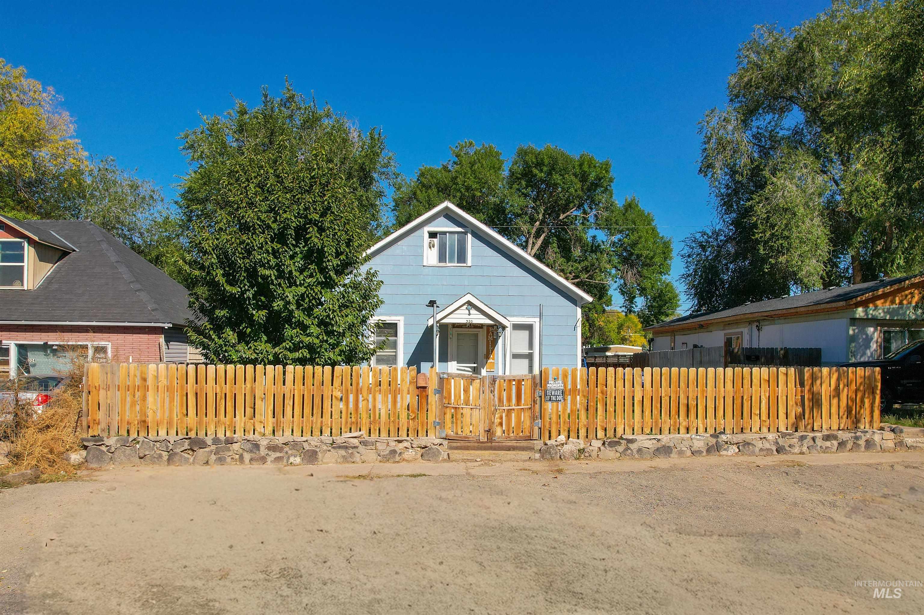 Bungalow-style home featuring a fenced front yard