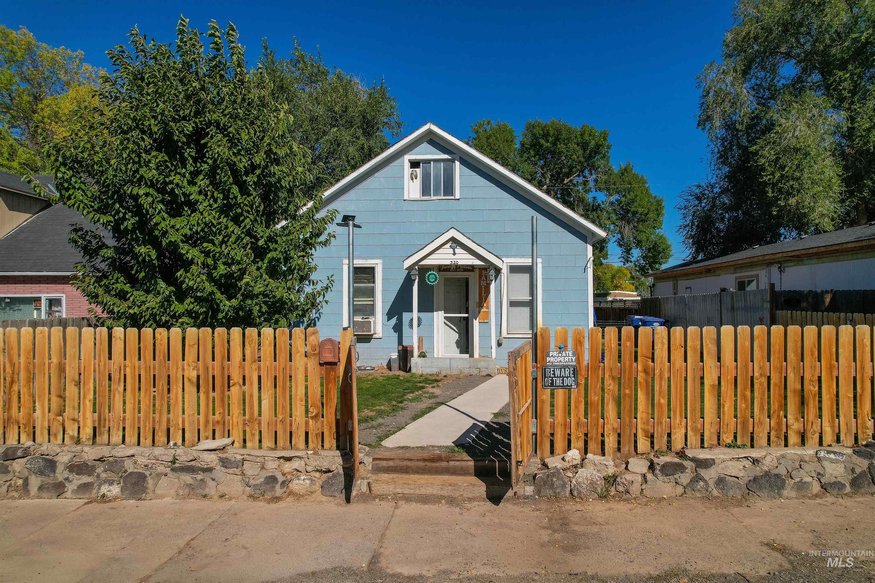 View of front of property featuring a fenced front yard