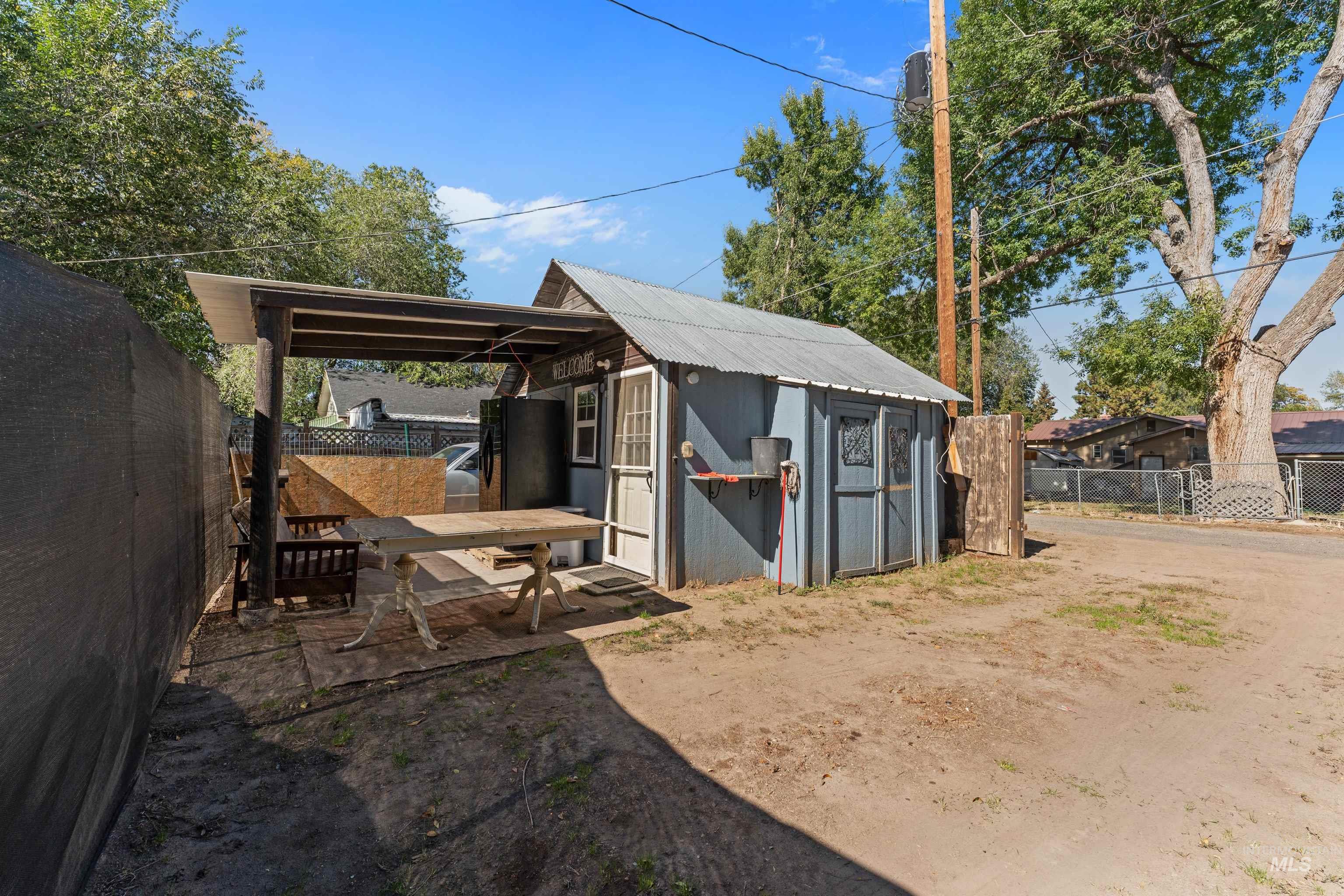 View of outbuilding featuring a fenced backyard