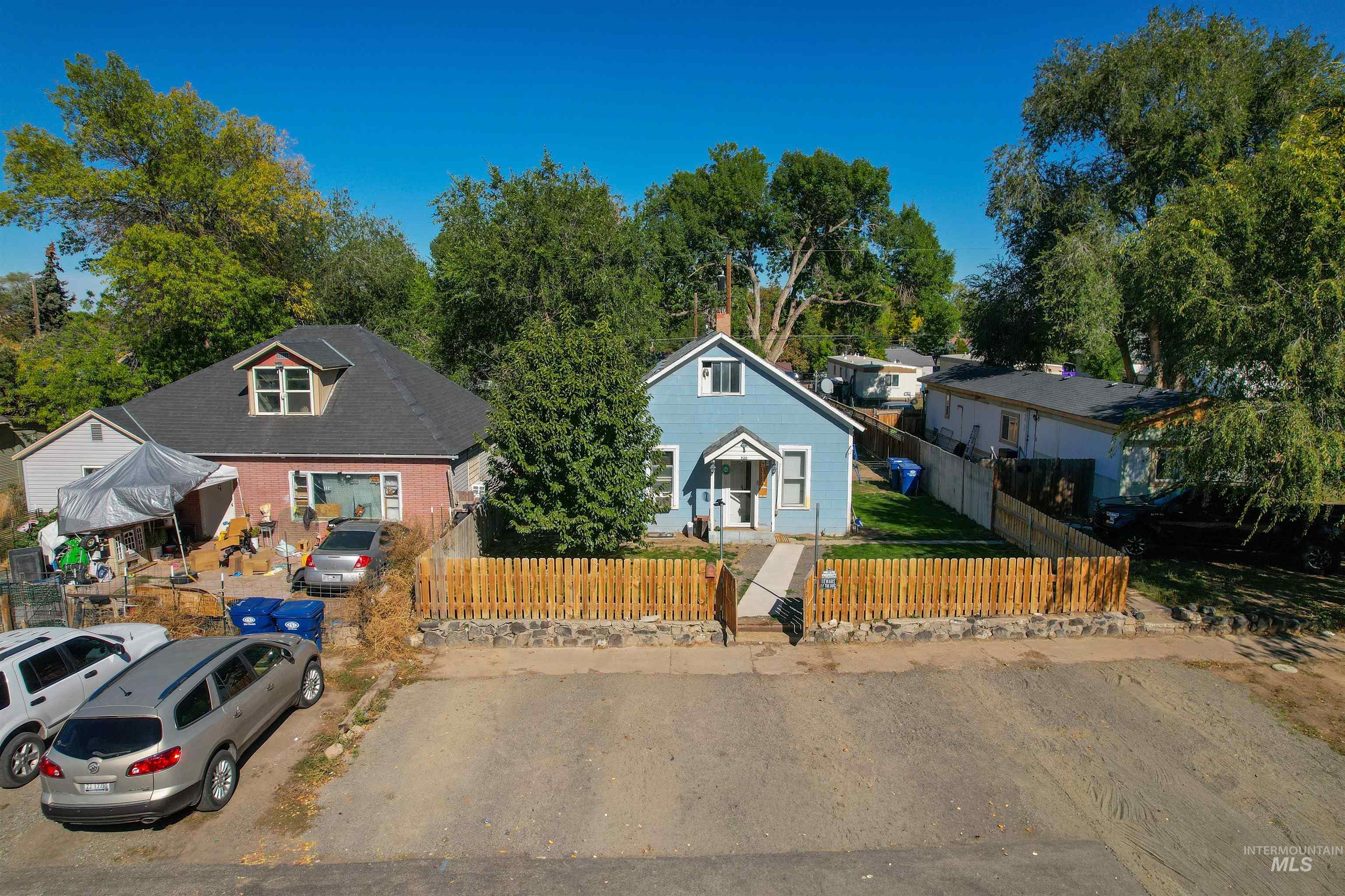 Bungalow-style house featuring a fenced front yard