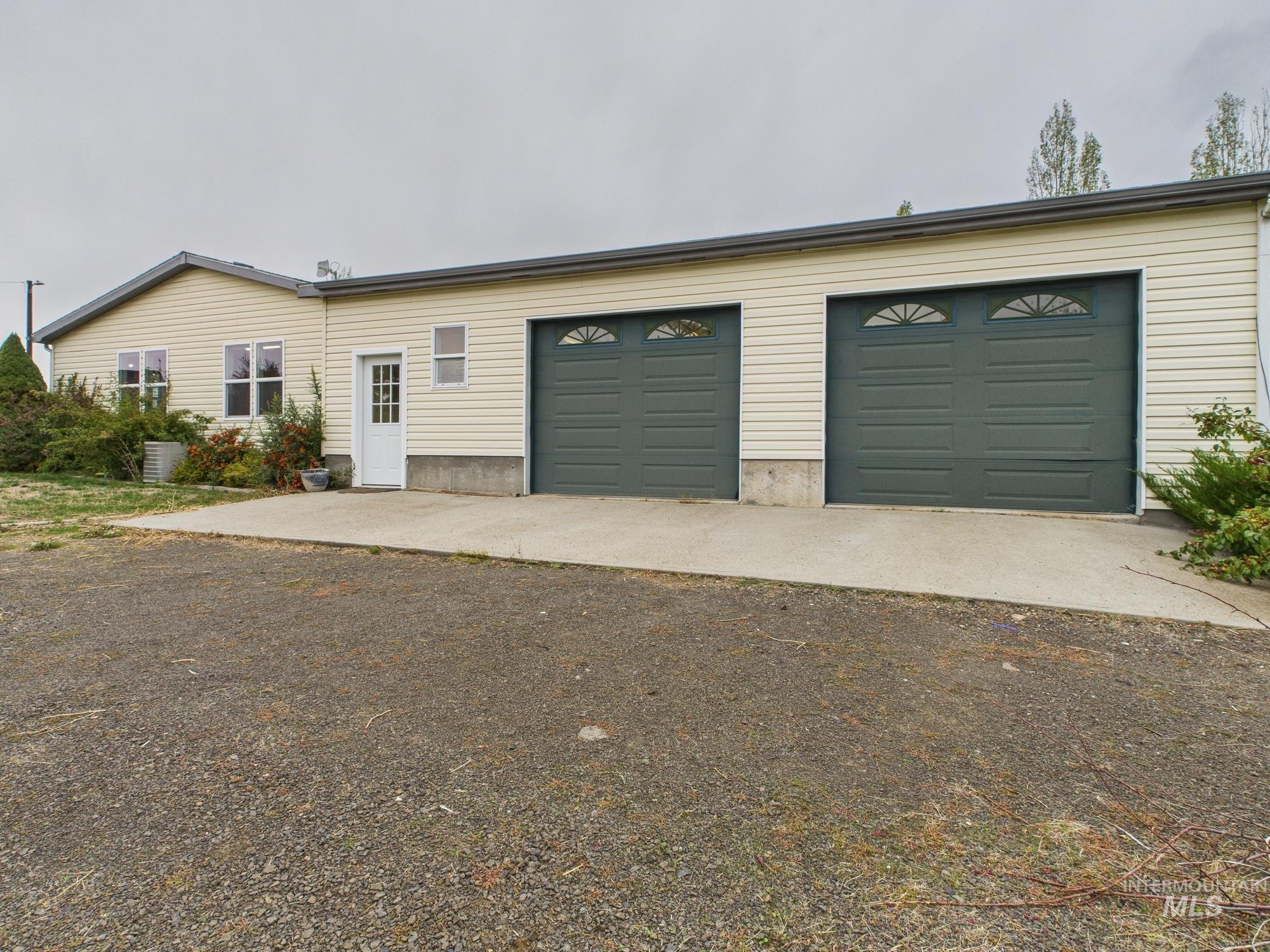 Ranch-style house featuring a garage