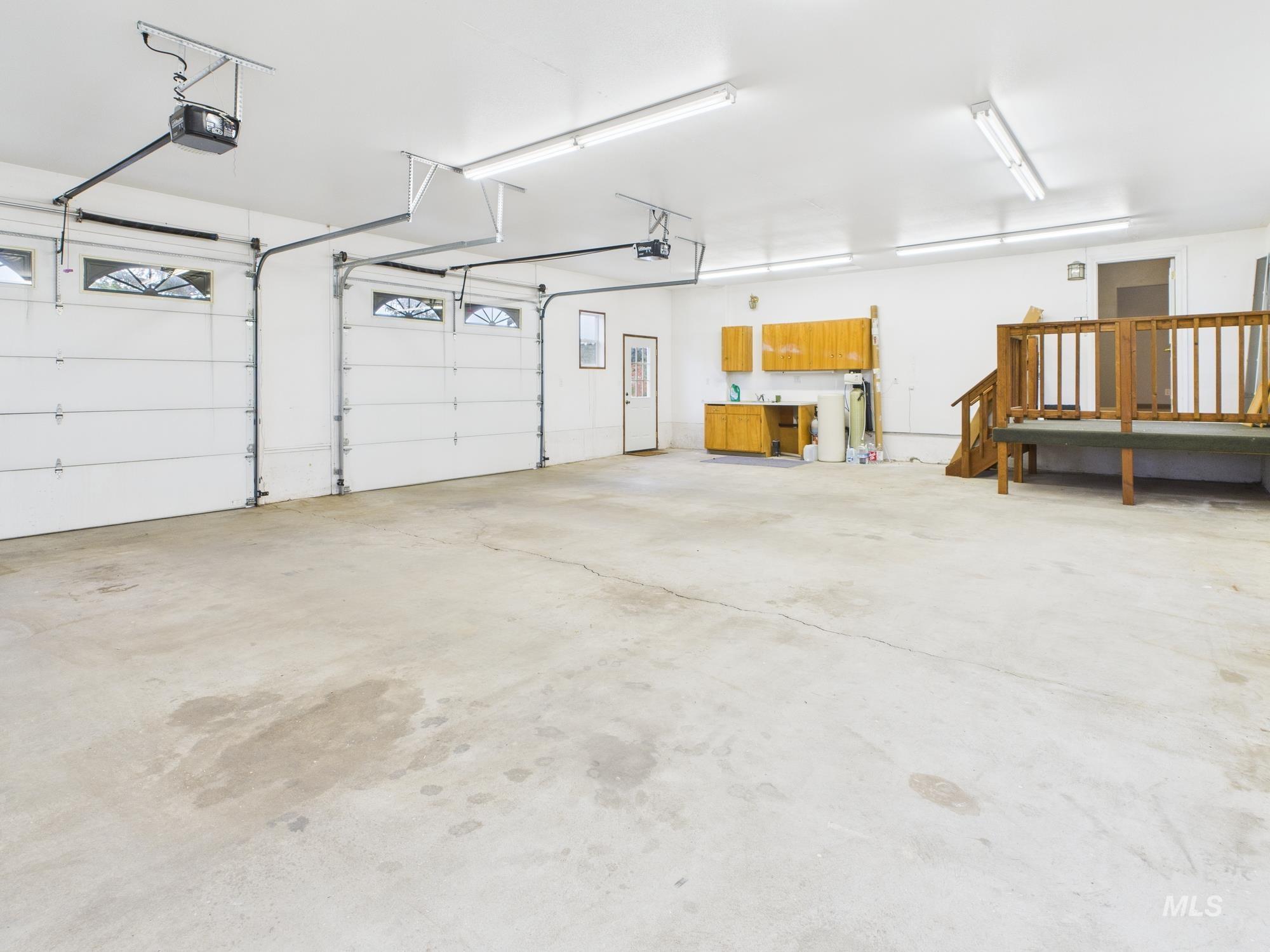 Garage featuring a garage door opener