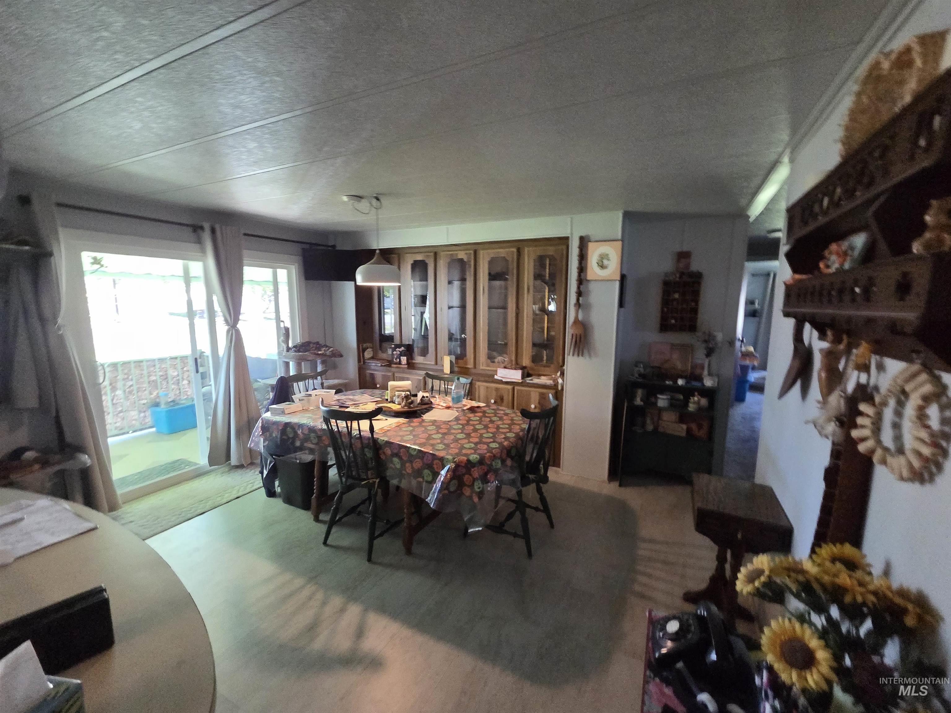 Dining room featuring a textured ceiling
