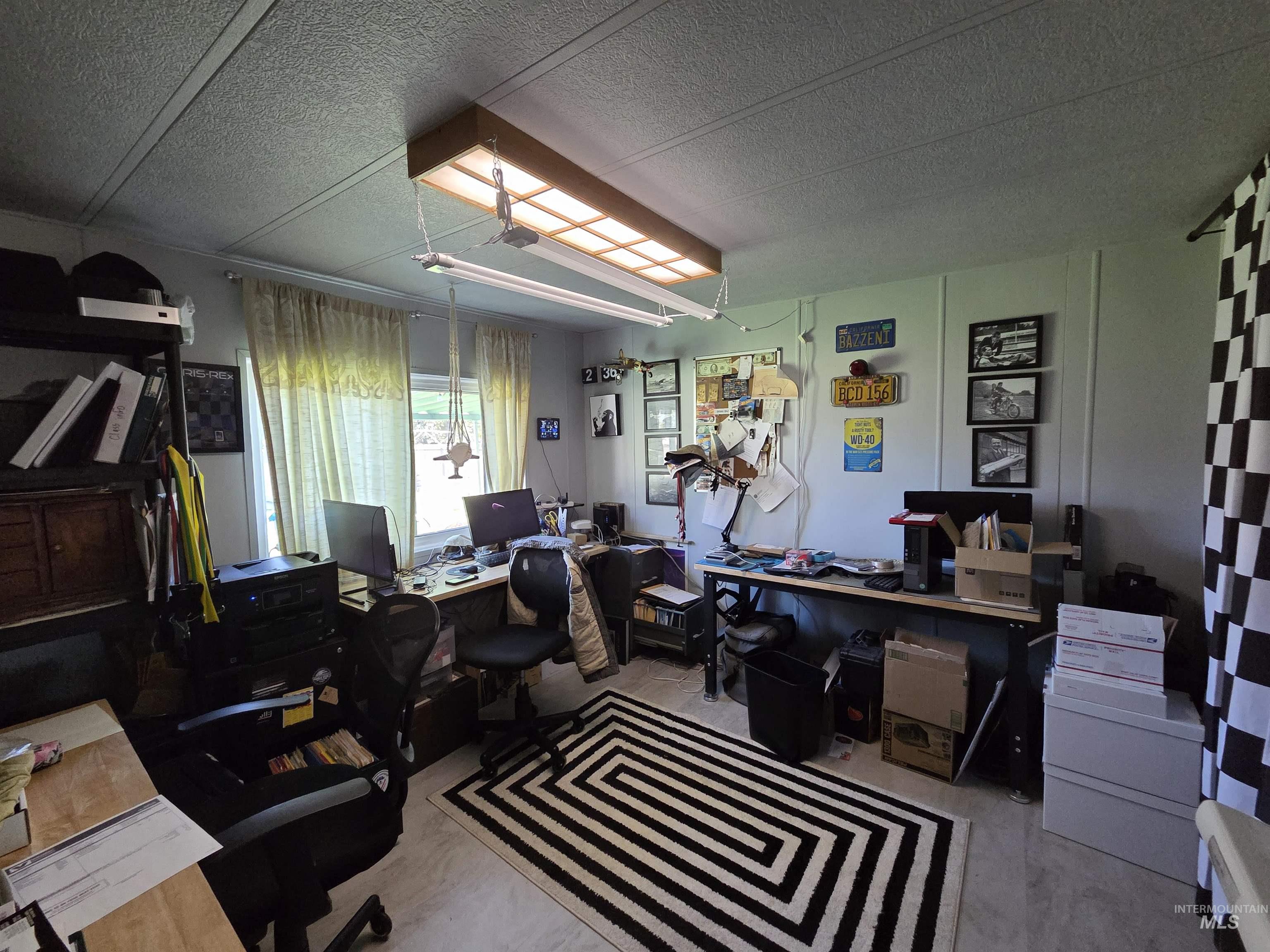Office area with a textured ceiling