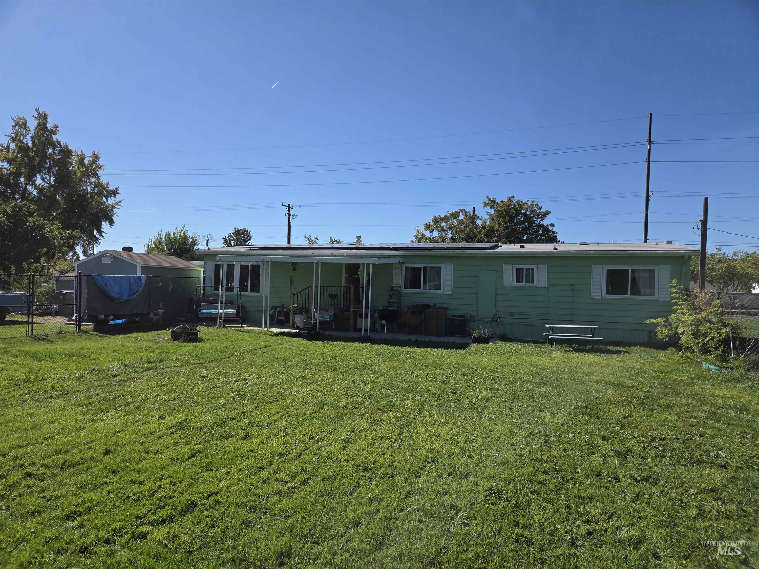 Rear view of house with a patio
