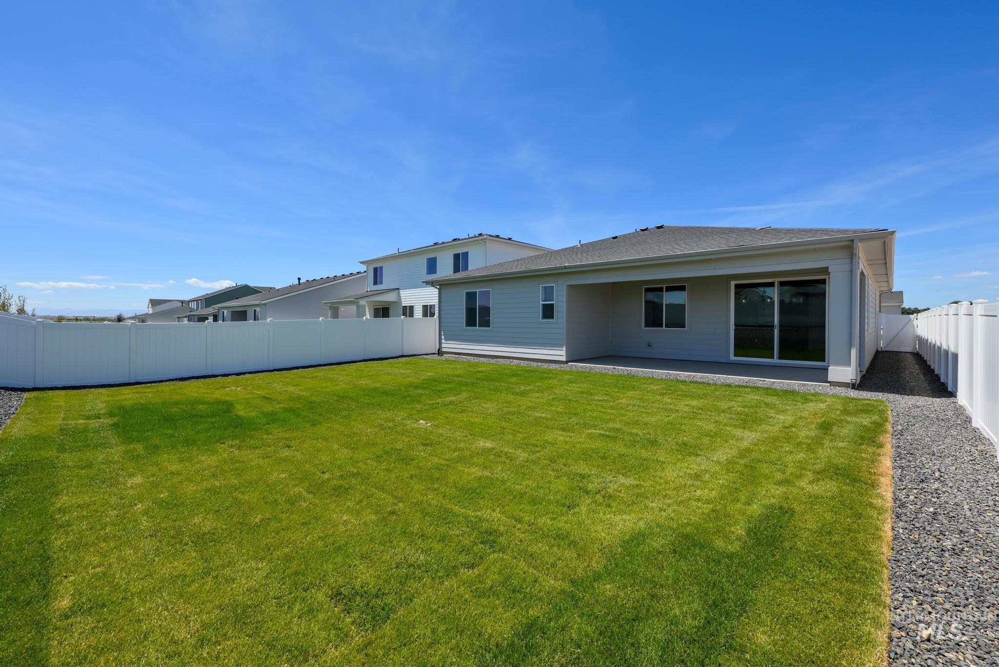 Back of house featuring a patio and a fenced backyard
