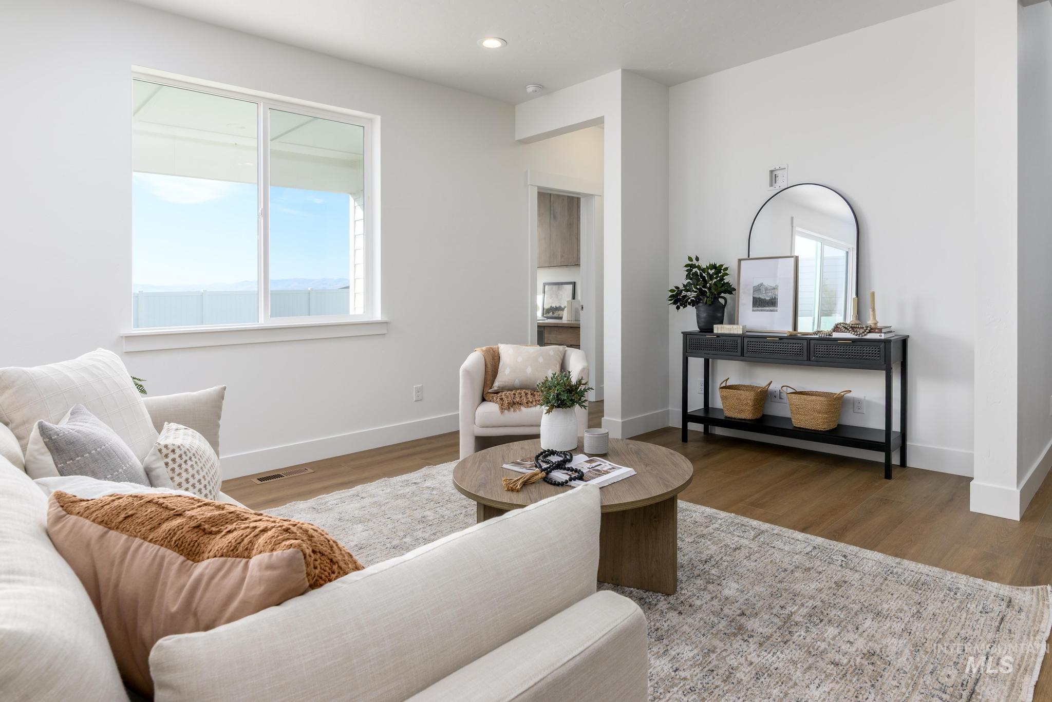 Living area featuring wood finished floors and recessed lighting