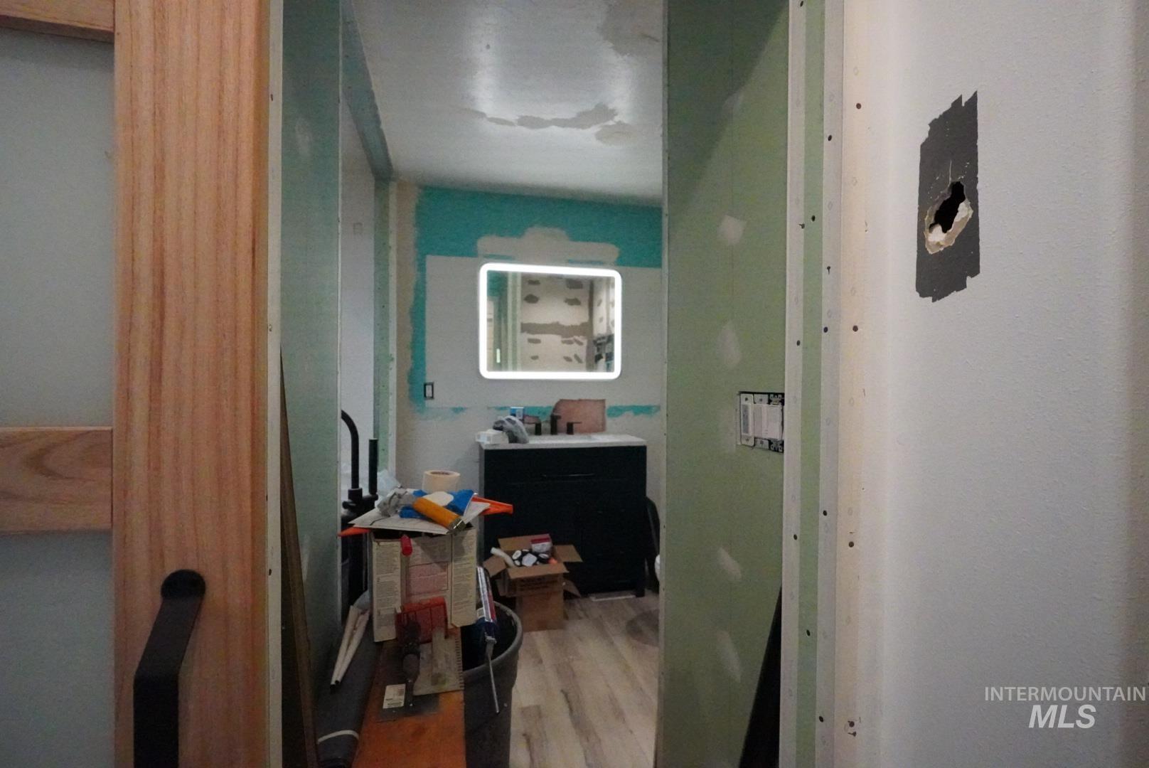 Hall with light wood finished floors