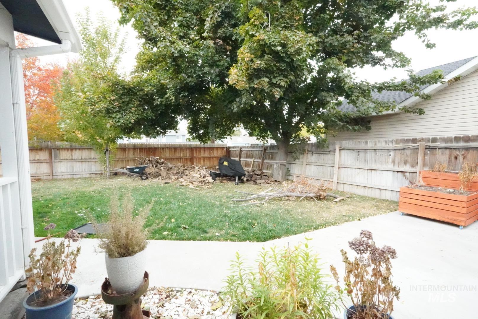 View of fenced backyard