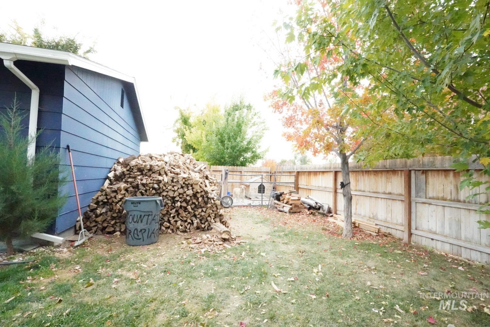 View of fenced backyard