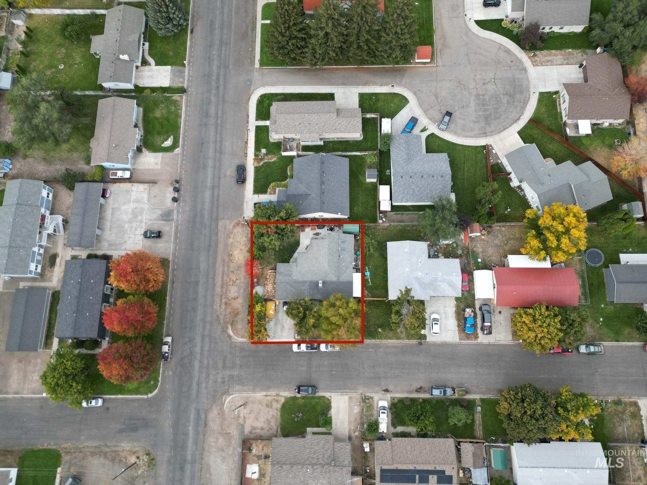Aerial perspective of suburban area featuring property parcel outlined