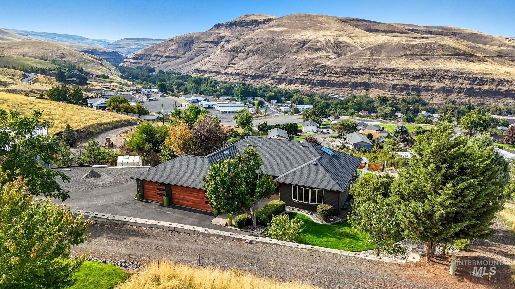 Aerial view of residential area featuring mountains