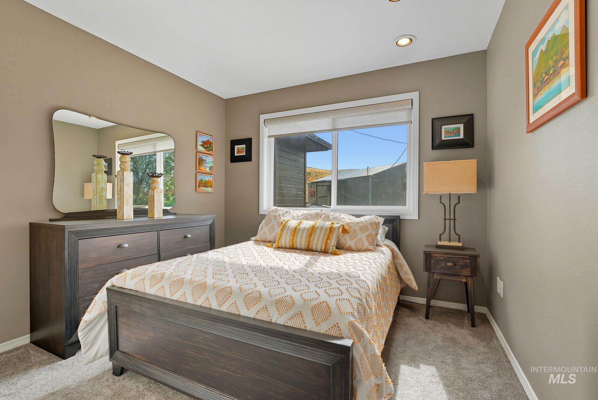 Bedroom featuring baseboards and carpet flooring