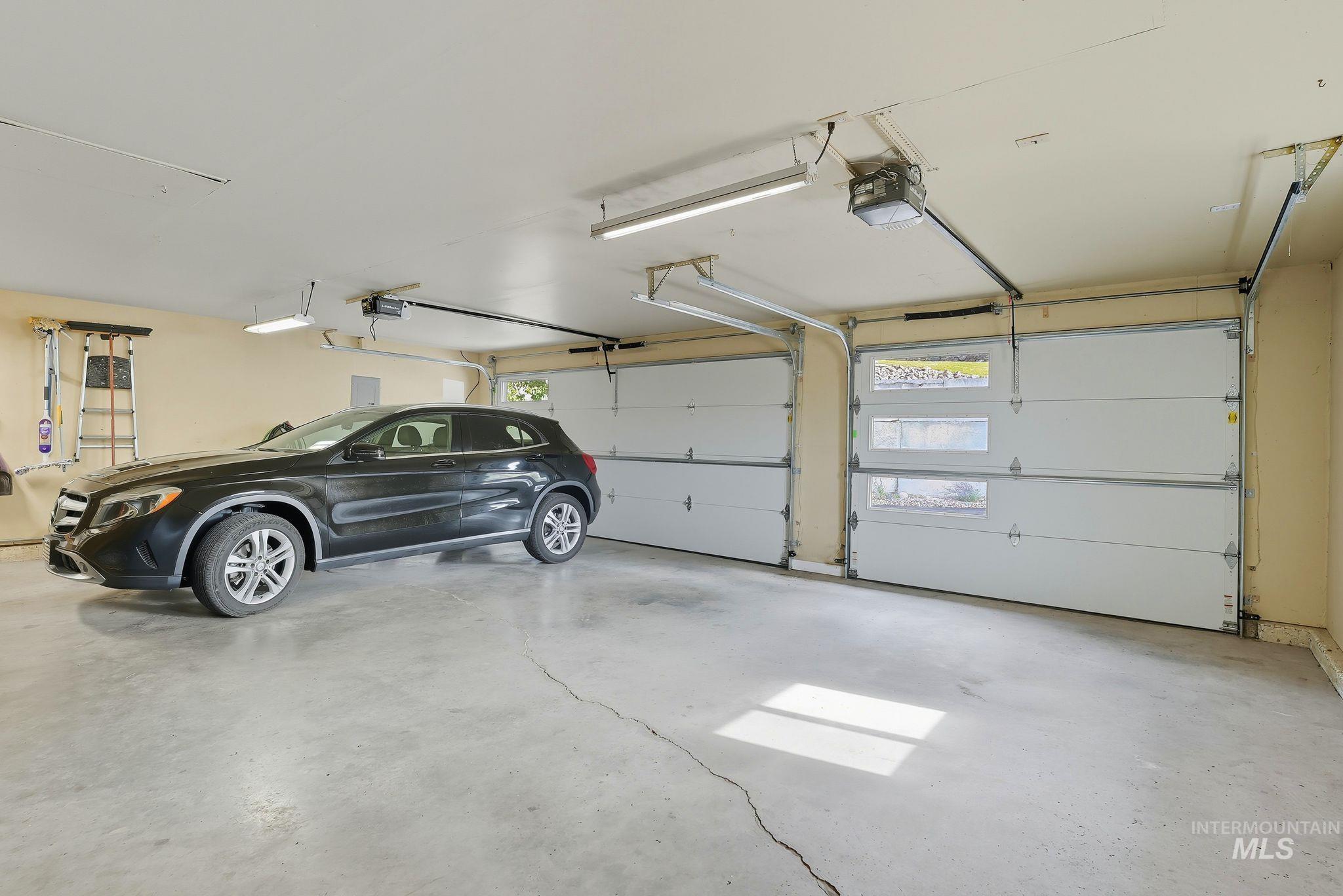 Garage featuring a garage door opener