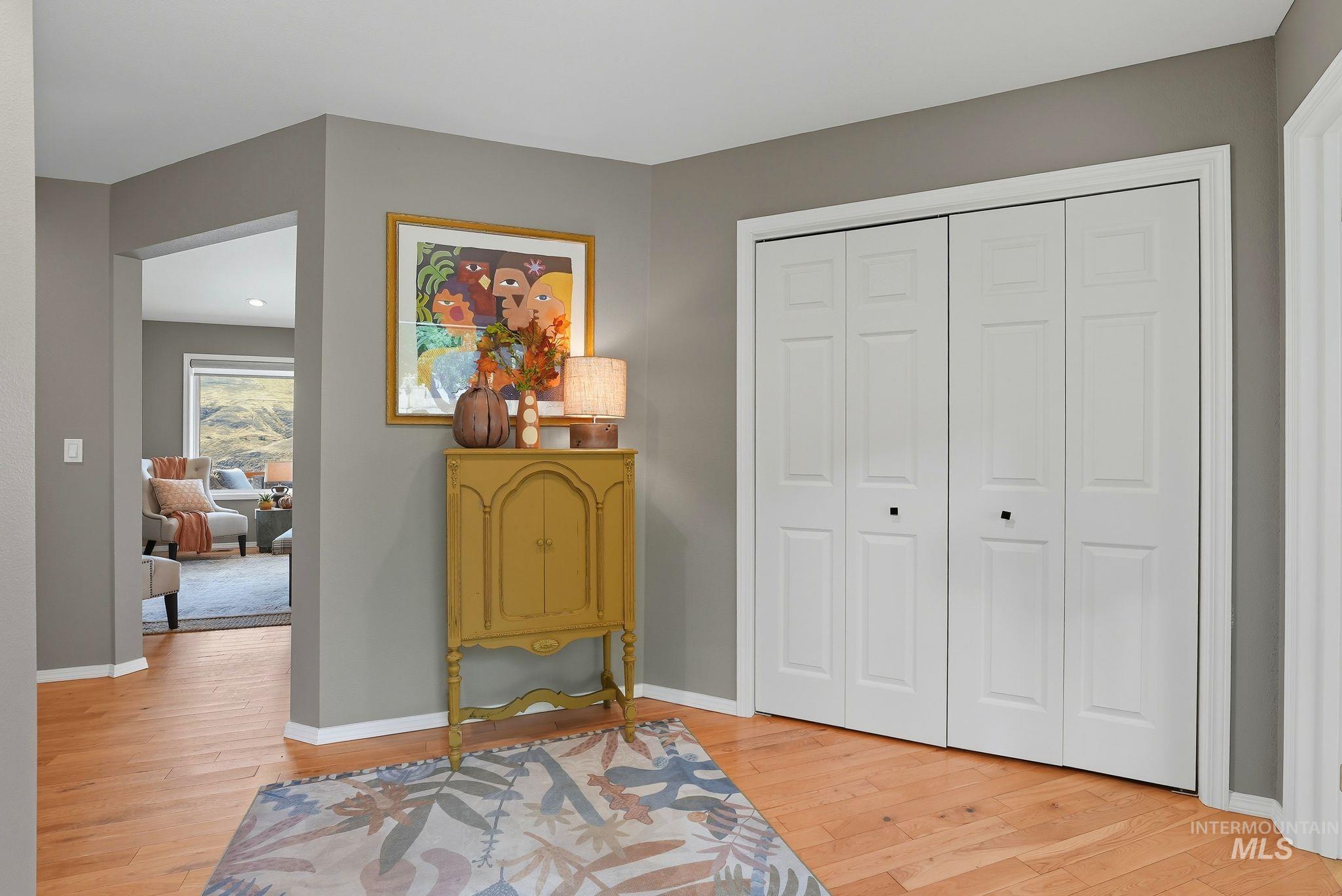 Sitting room featuring light wood-style flooring