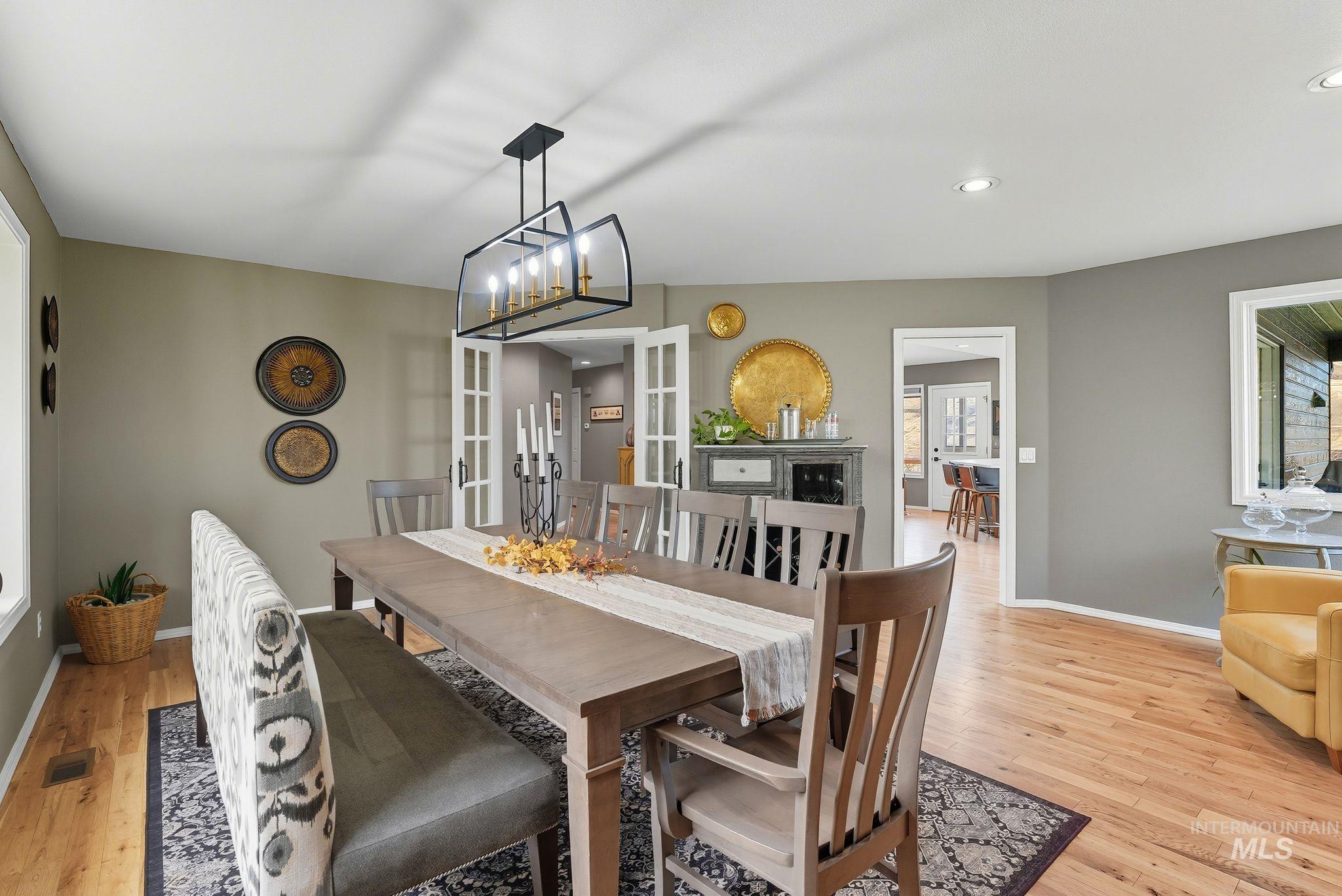 Dining area featuring french doors, recessed lighting, and light wood-style flooring