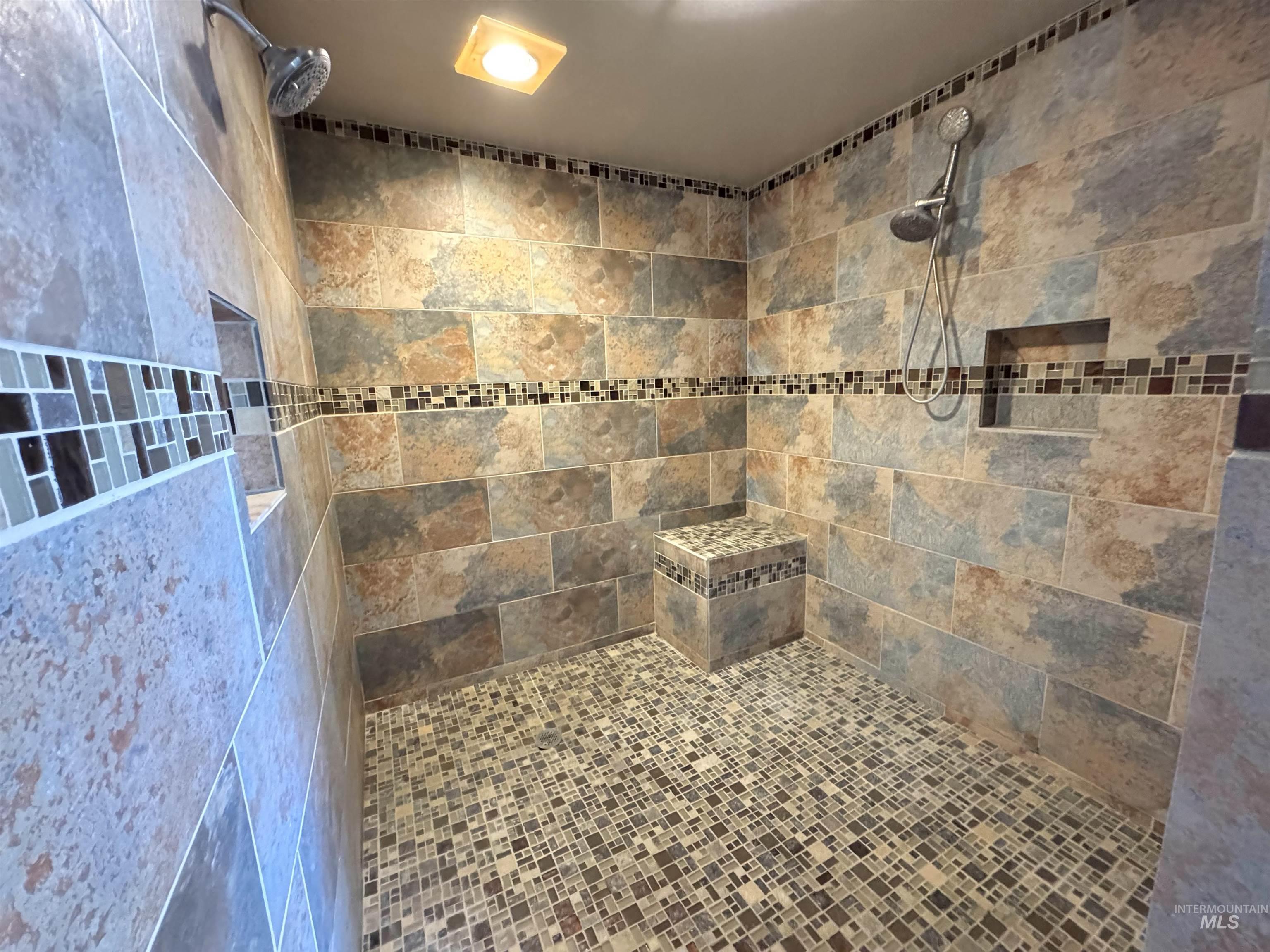 Full bath with a tile shower