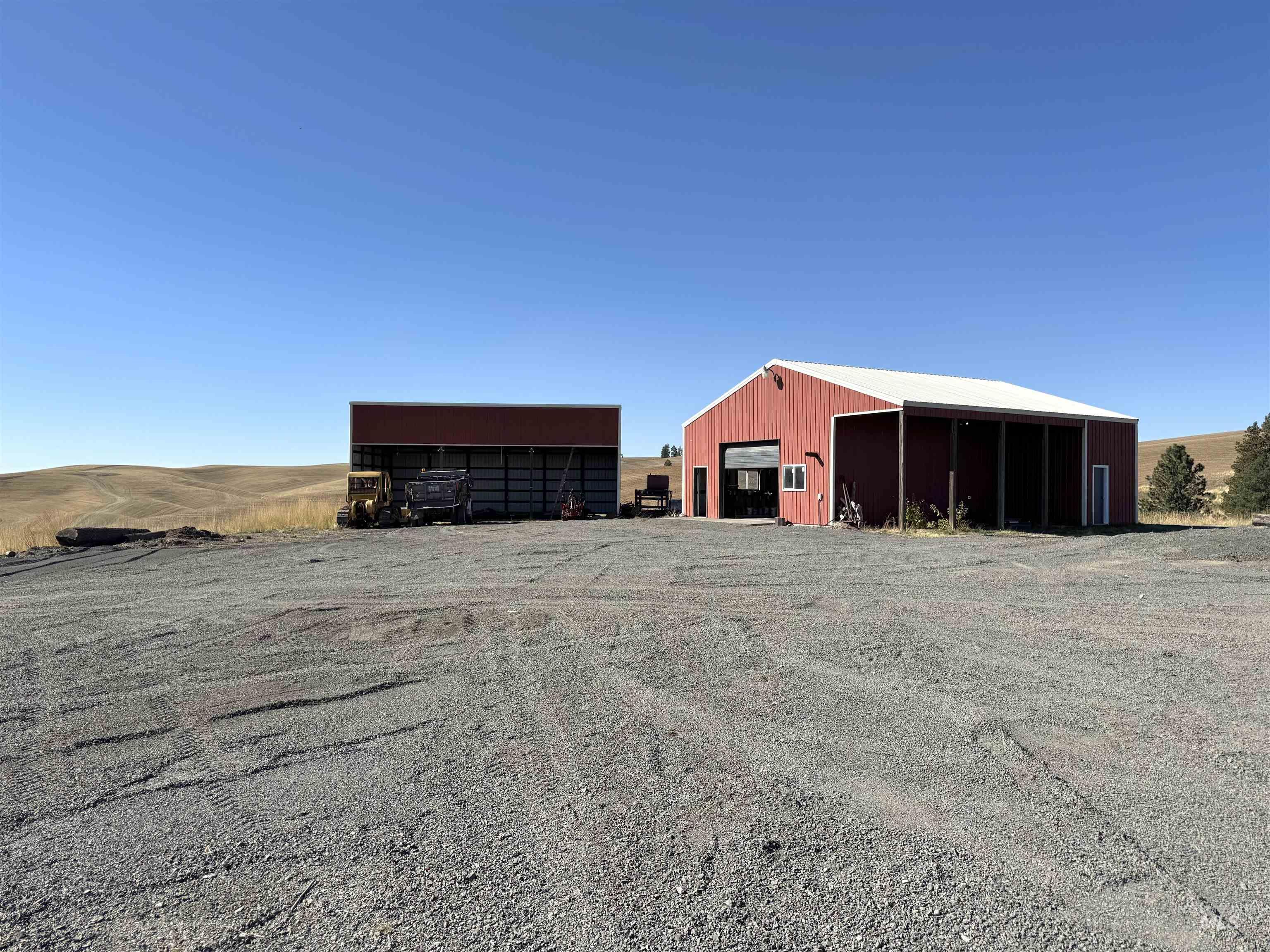 View of pole building with driveway