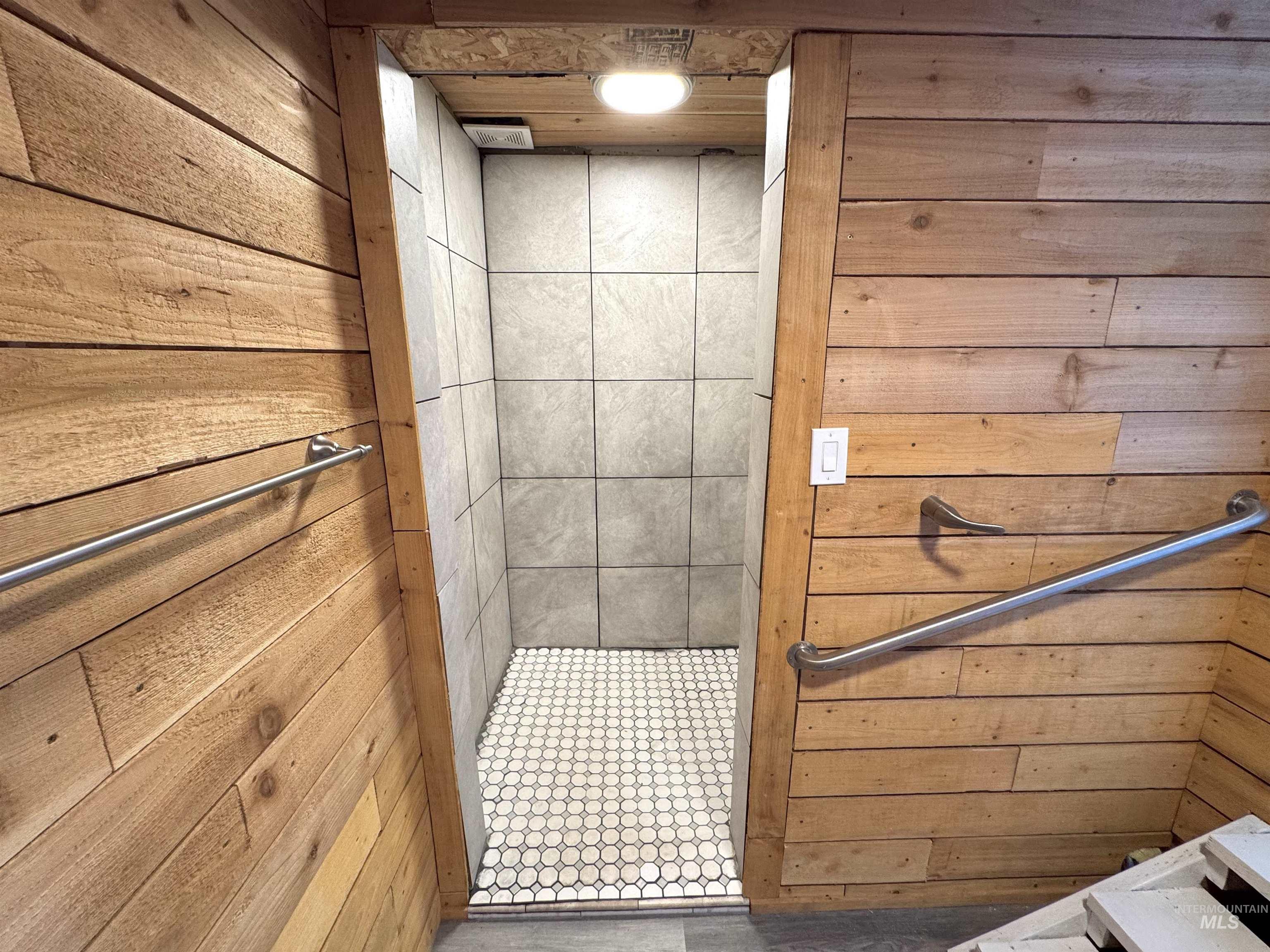 Bathroom with wood walls