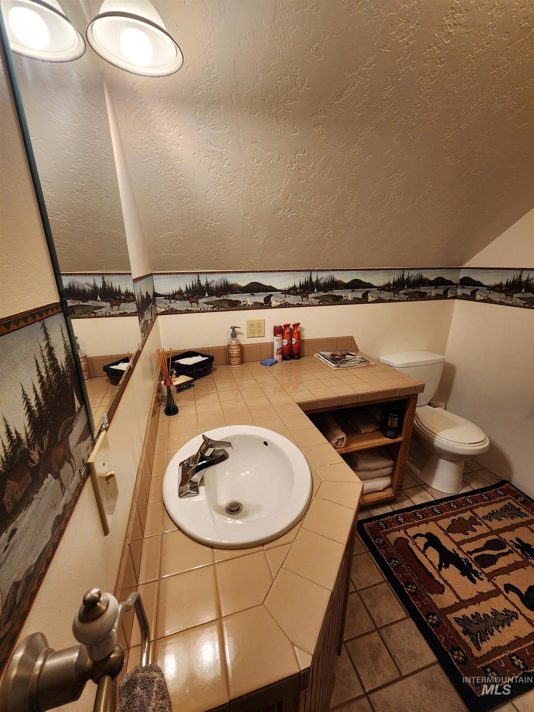 Bathroom upstairs of garage in living area