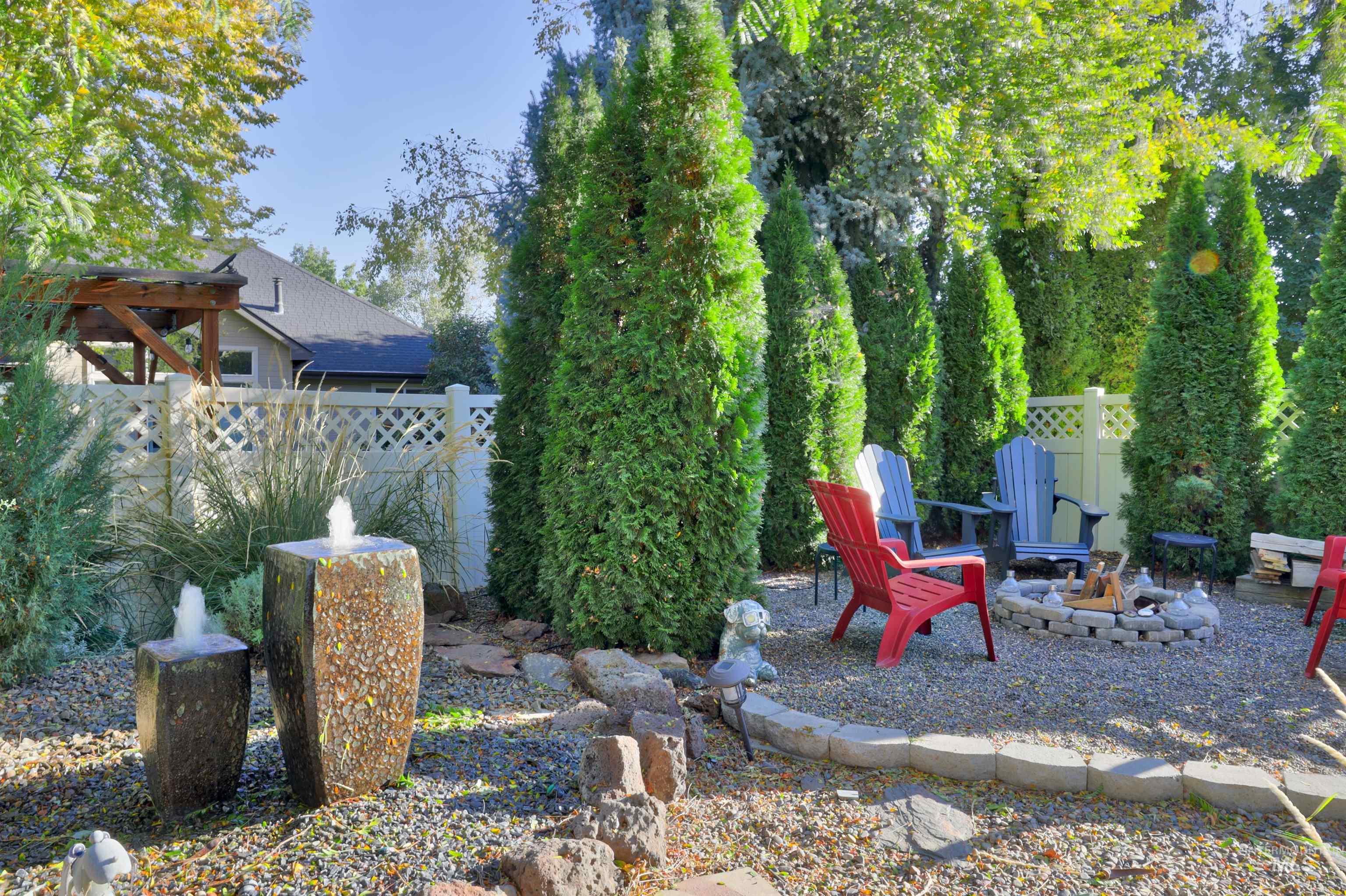 View of yard featuring a fire pit and a patio