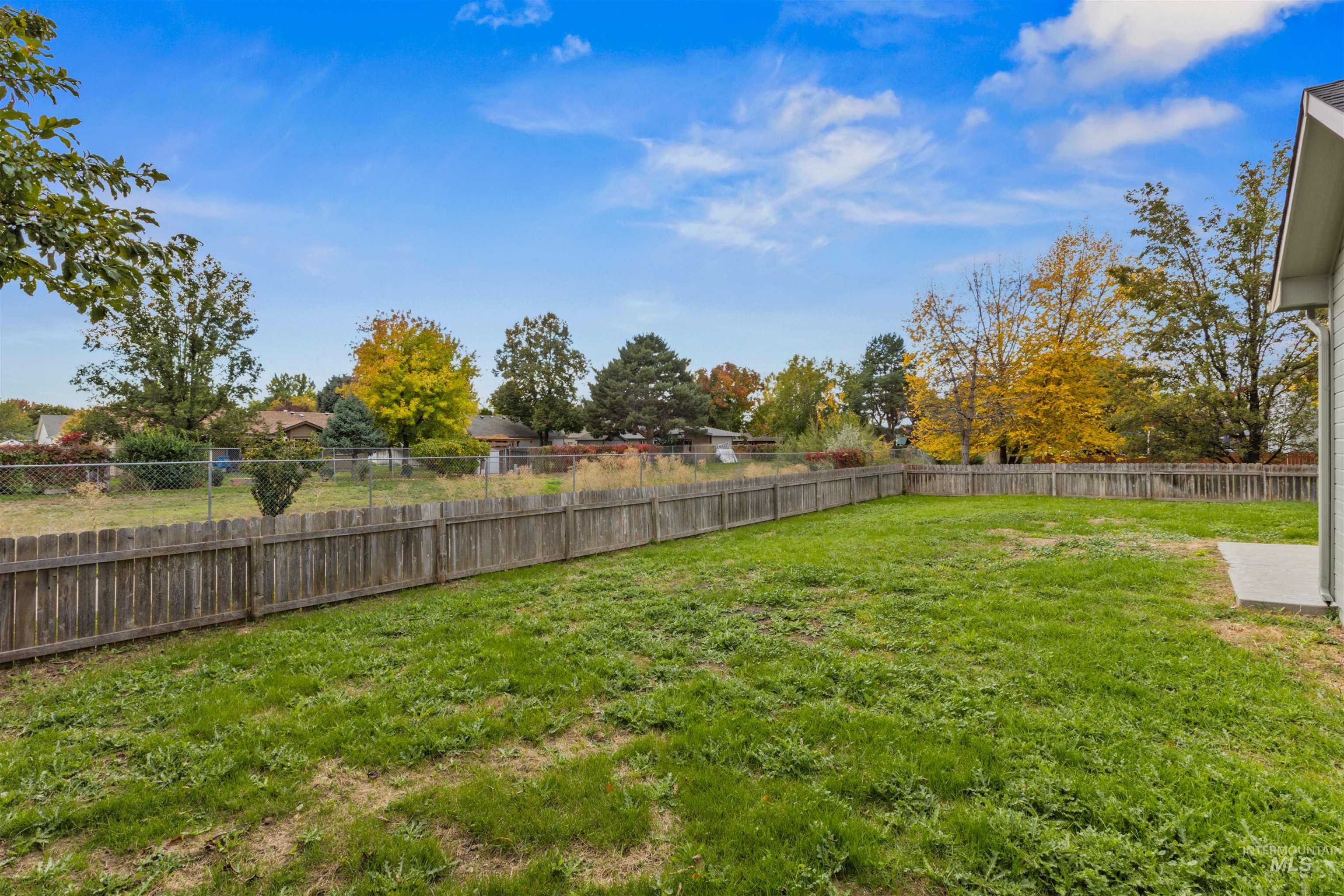 View of fenced backyard