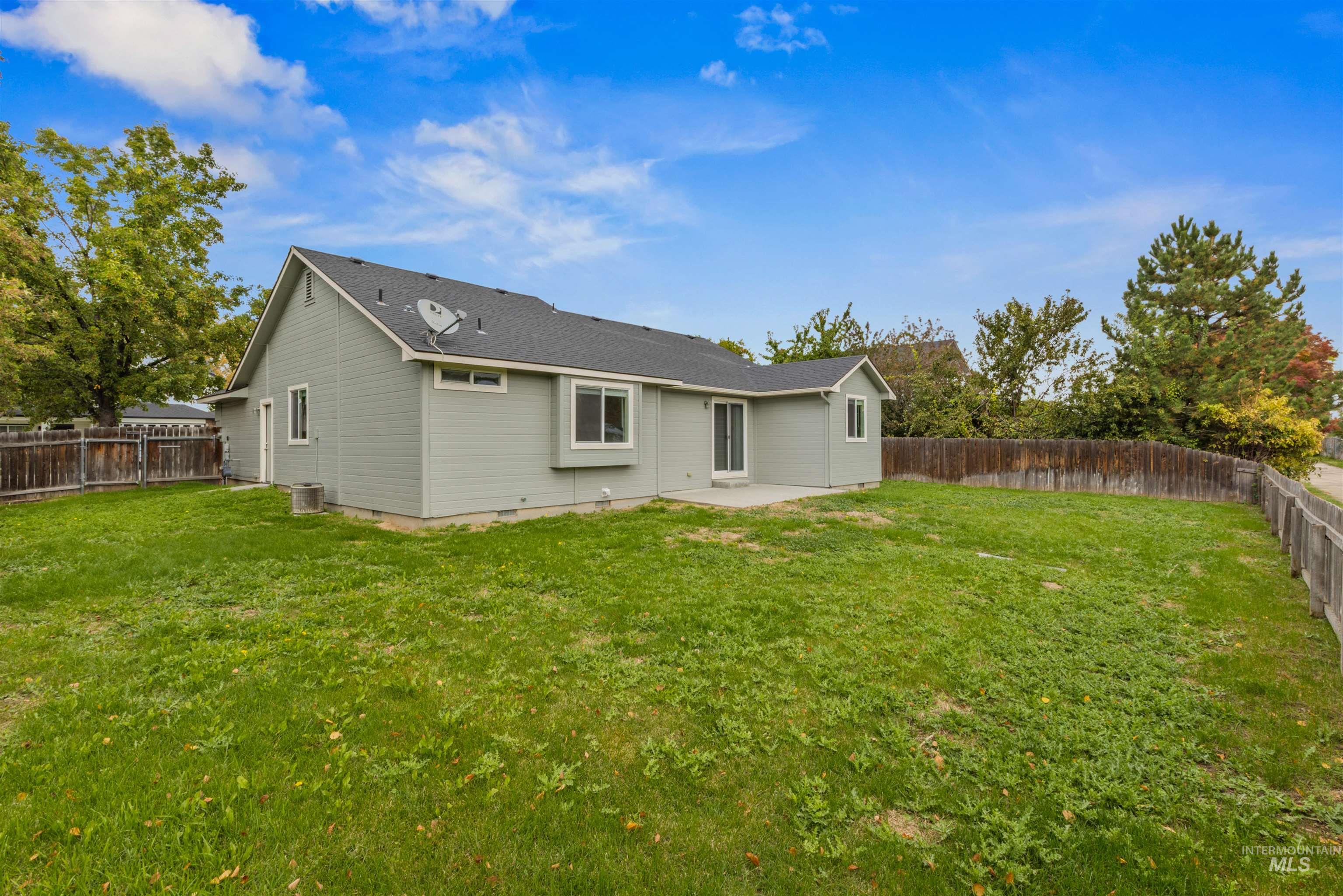Back of property featuring a patio area, a fenced backyard, and crawl space