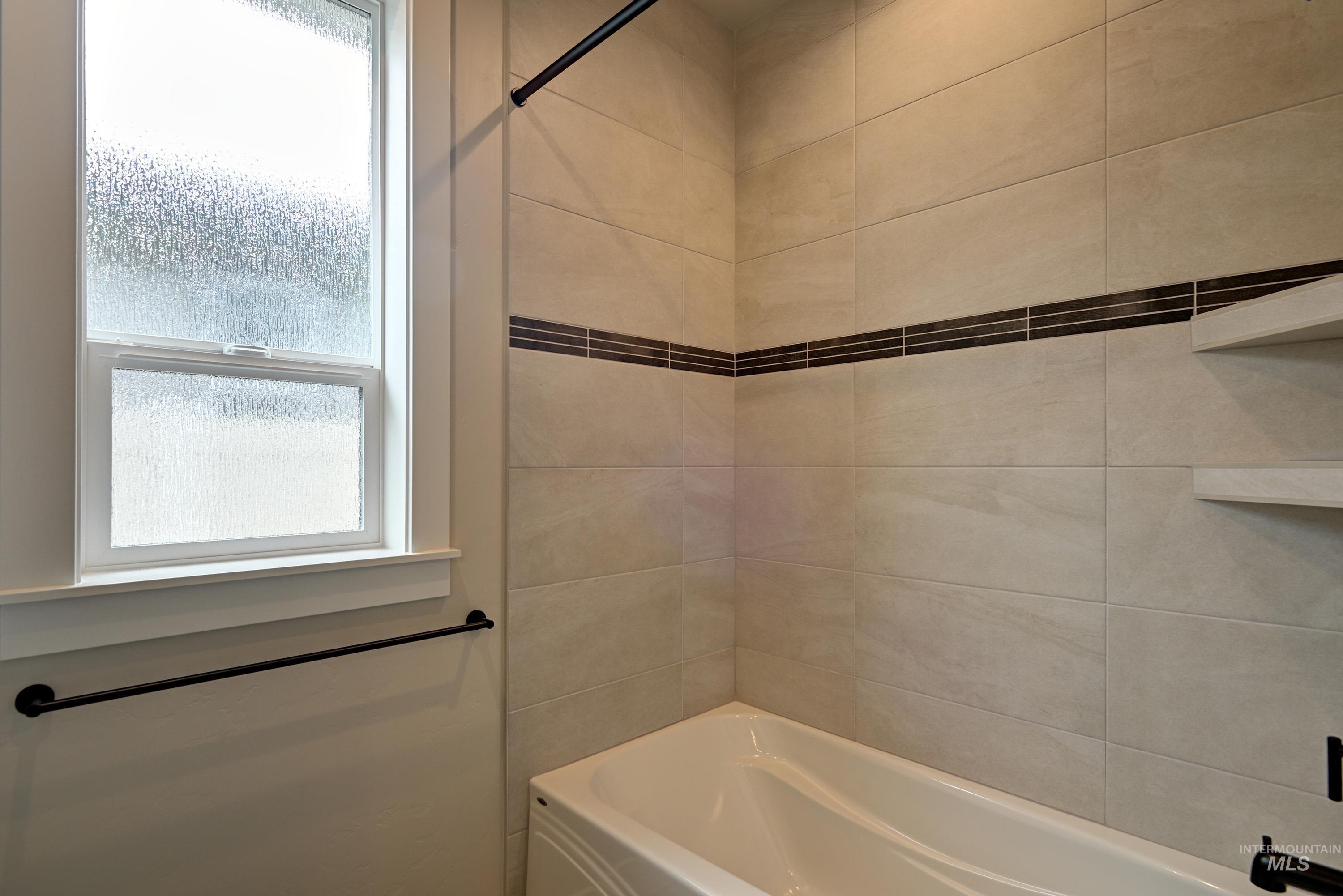 Full bath featuring shower / bathtub combination