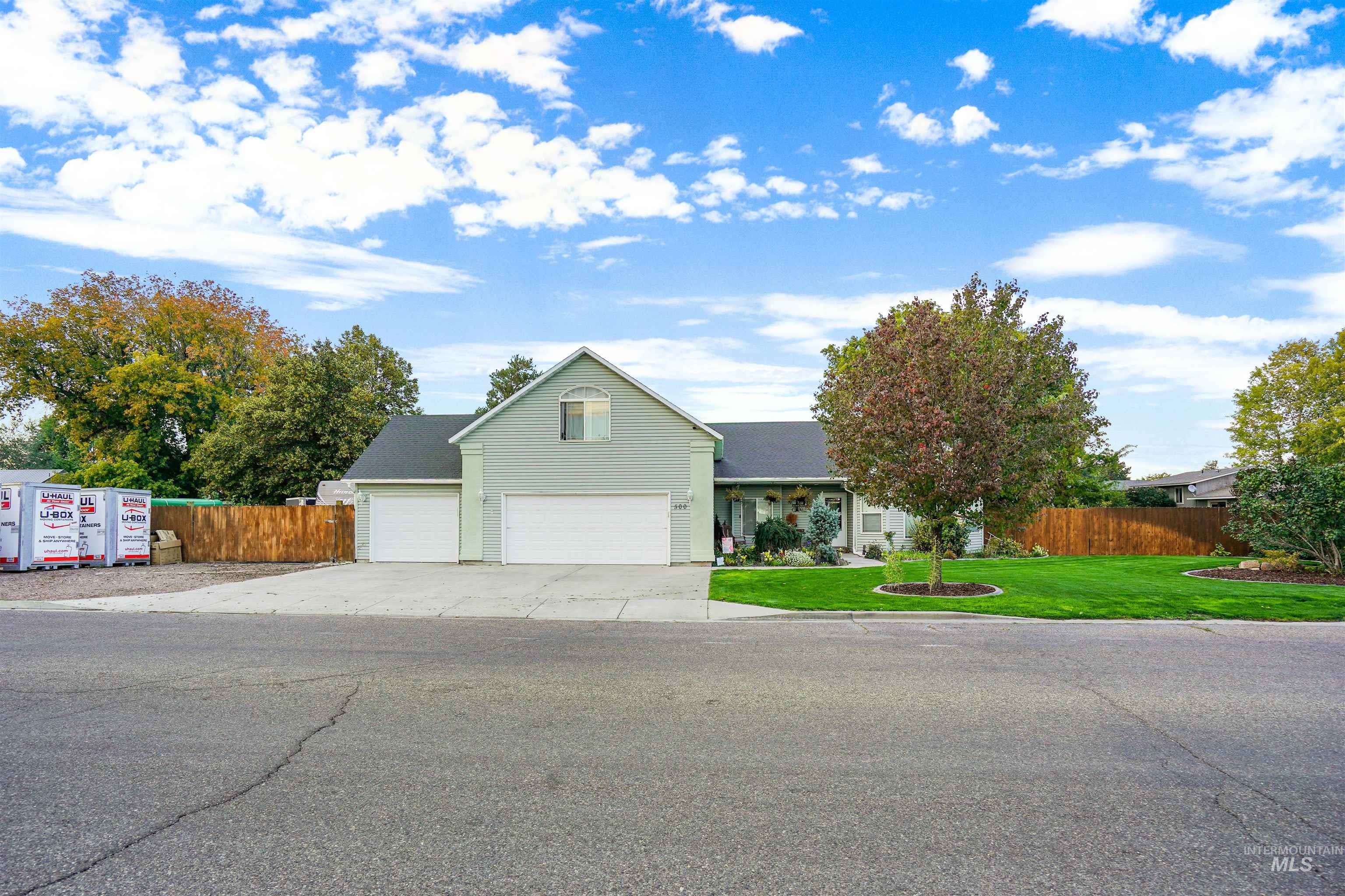 View of front of property with concrete driveway