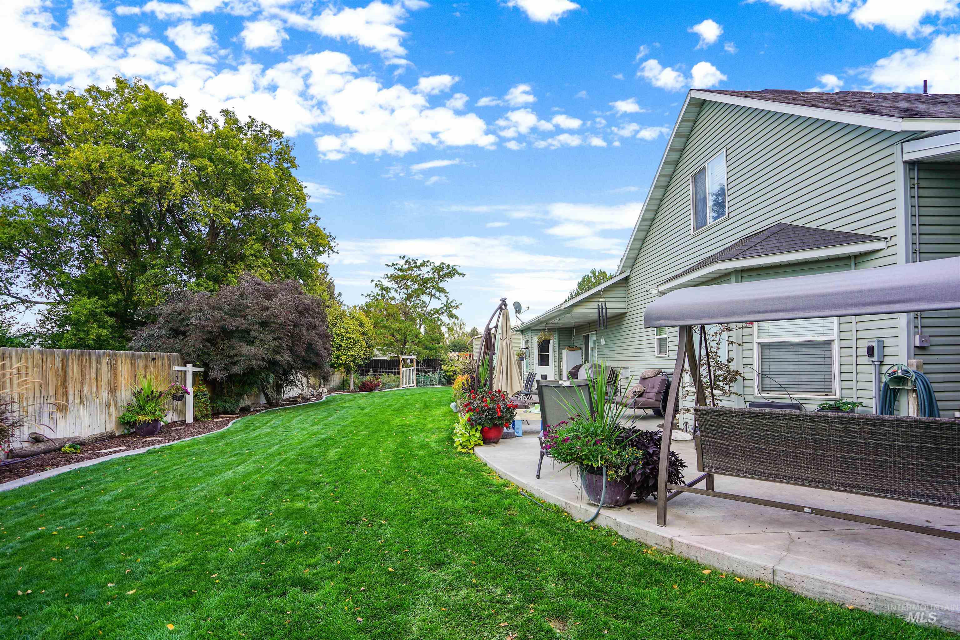 Fenced backyard featuring outdoor lounge area and a patio