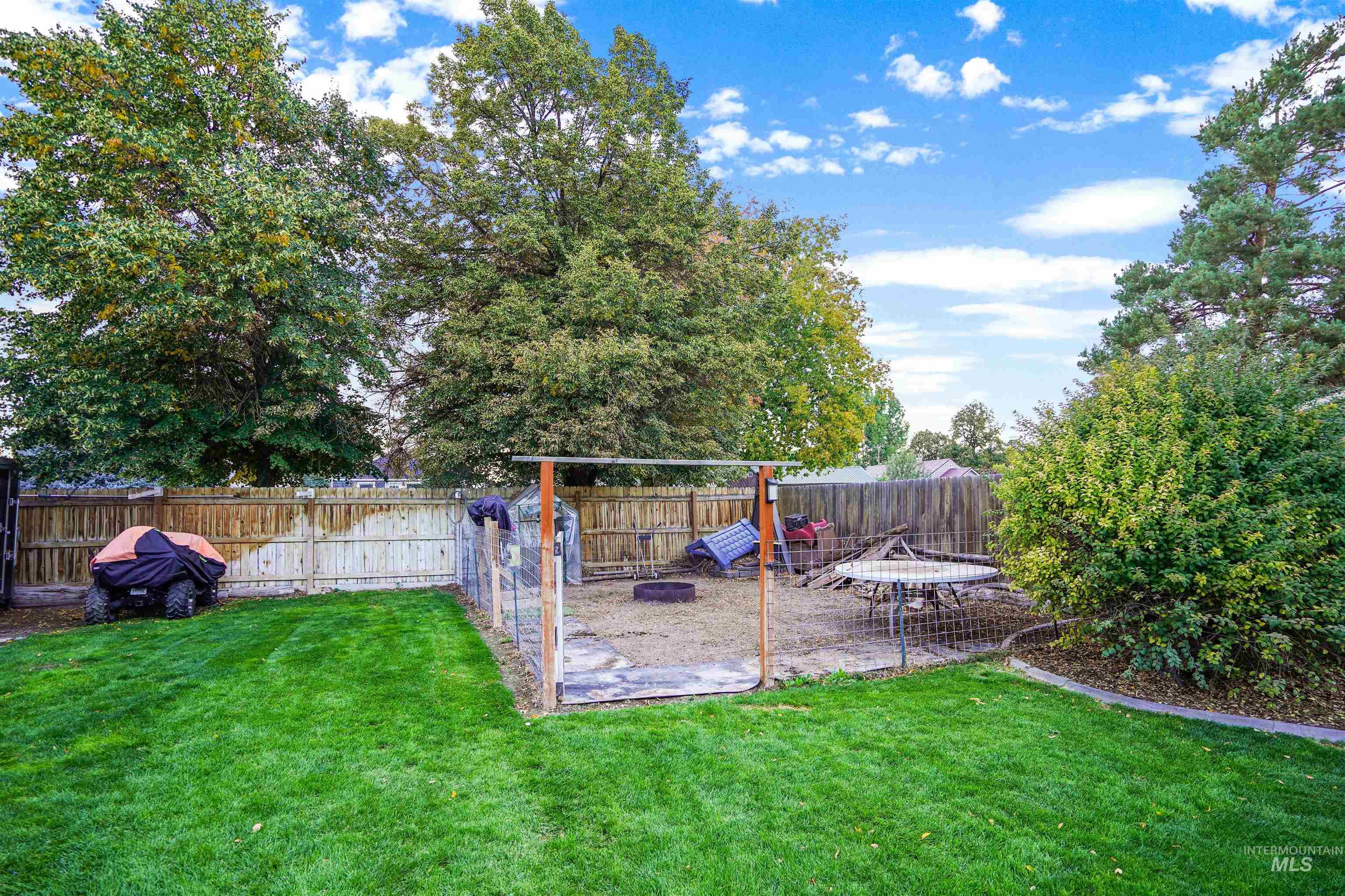 Fenced backyard with a patio area