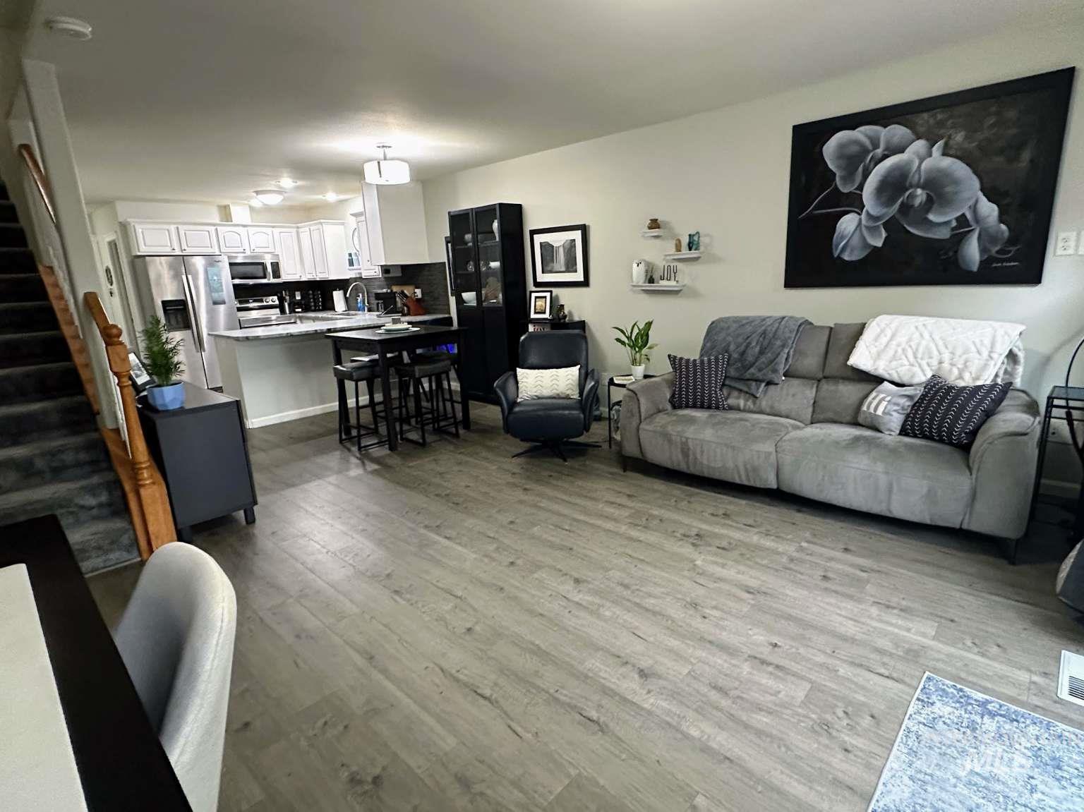 Living area with wood finished floors and stairs
