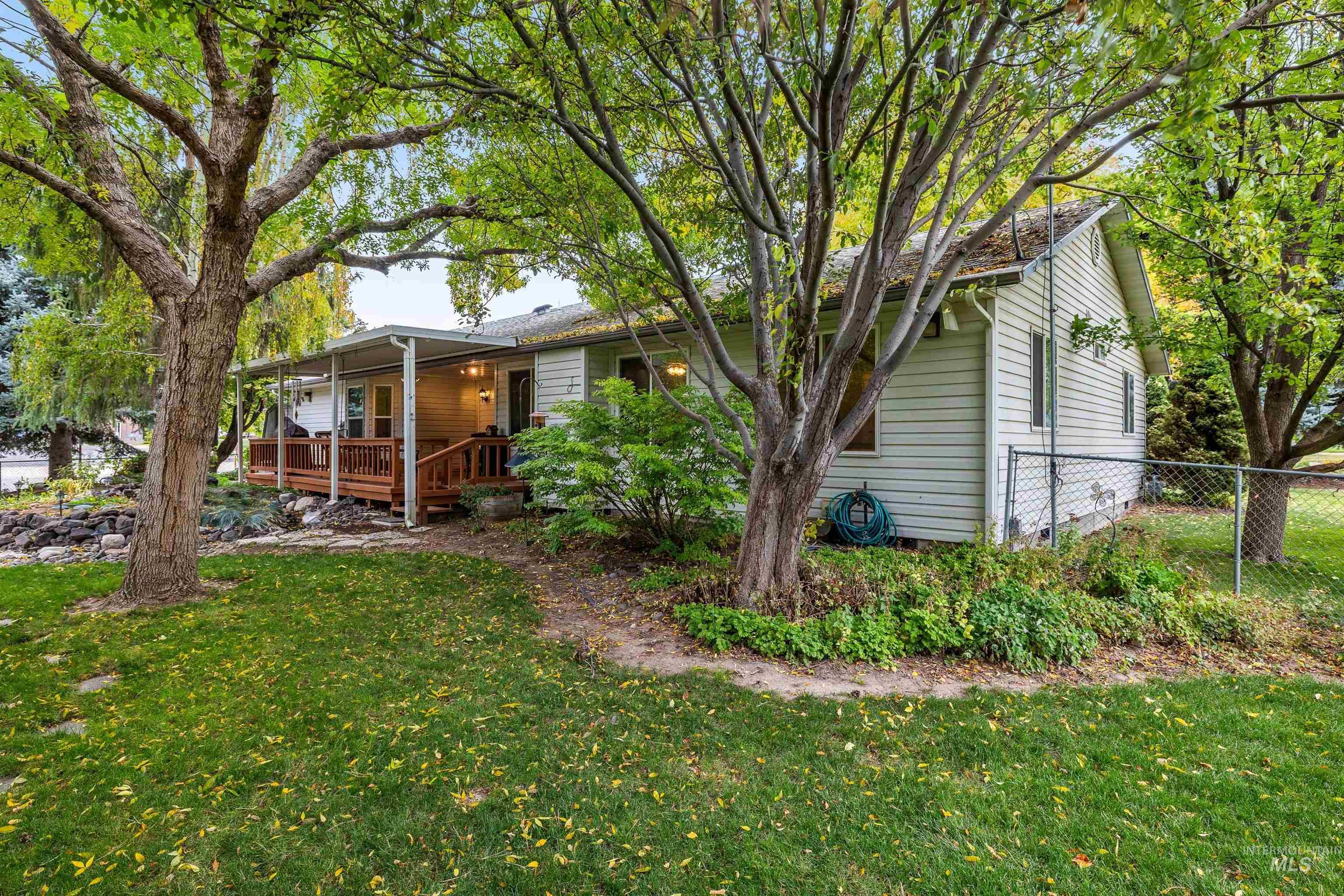 View of side of home featuring a deck