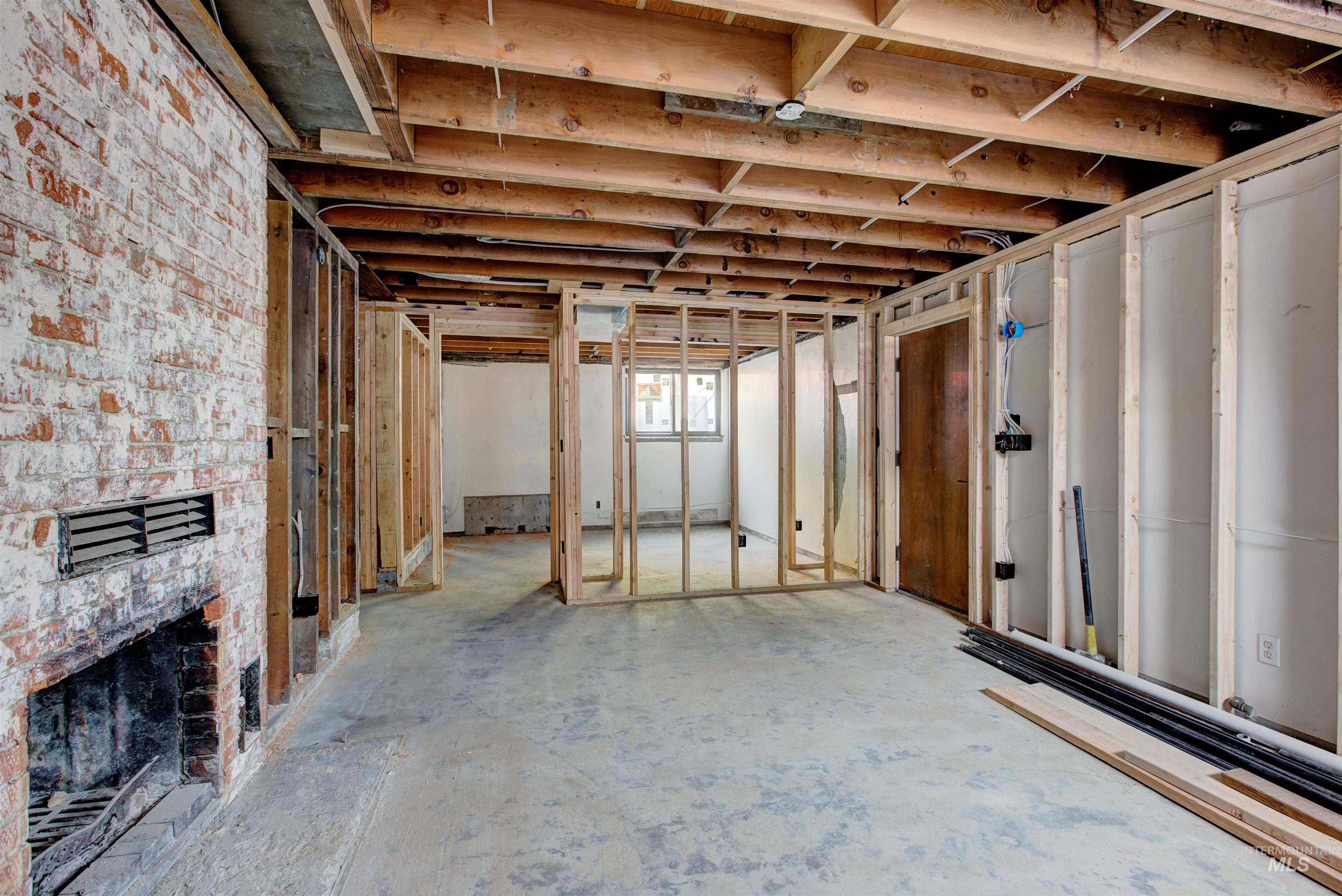 Below grade area featuring a brick fireplace