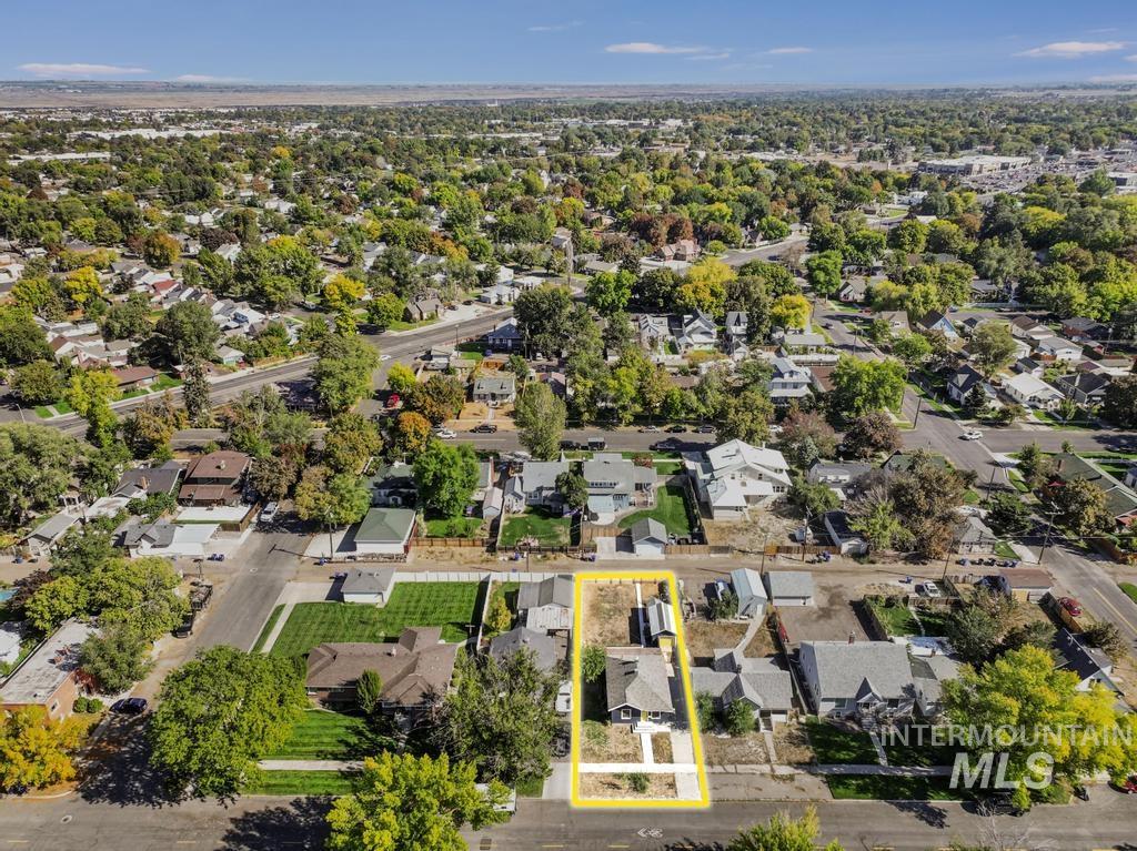 Aerial perspective of suburban area featuring property parcel outlined