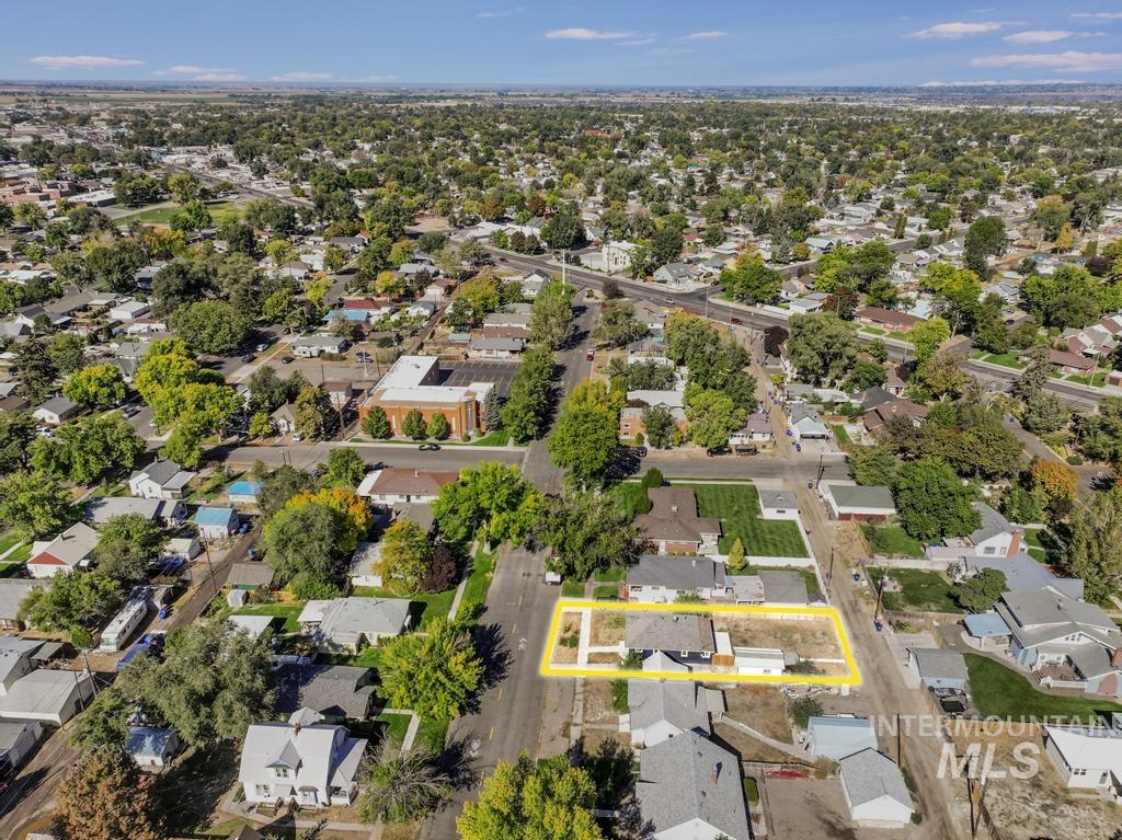 Aerial view of residential area with property parcel outlined