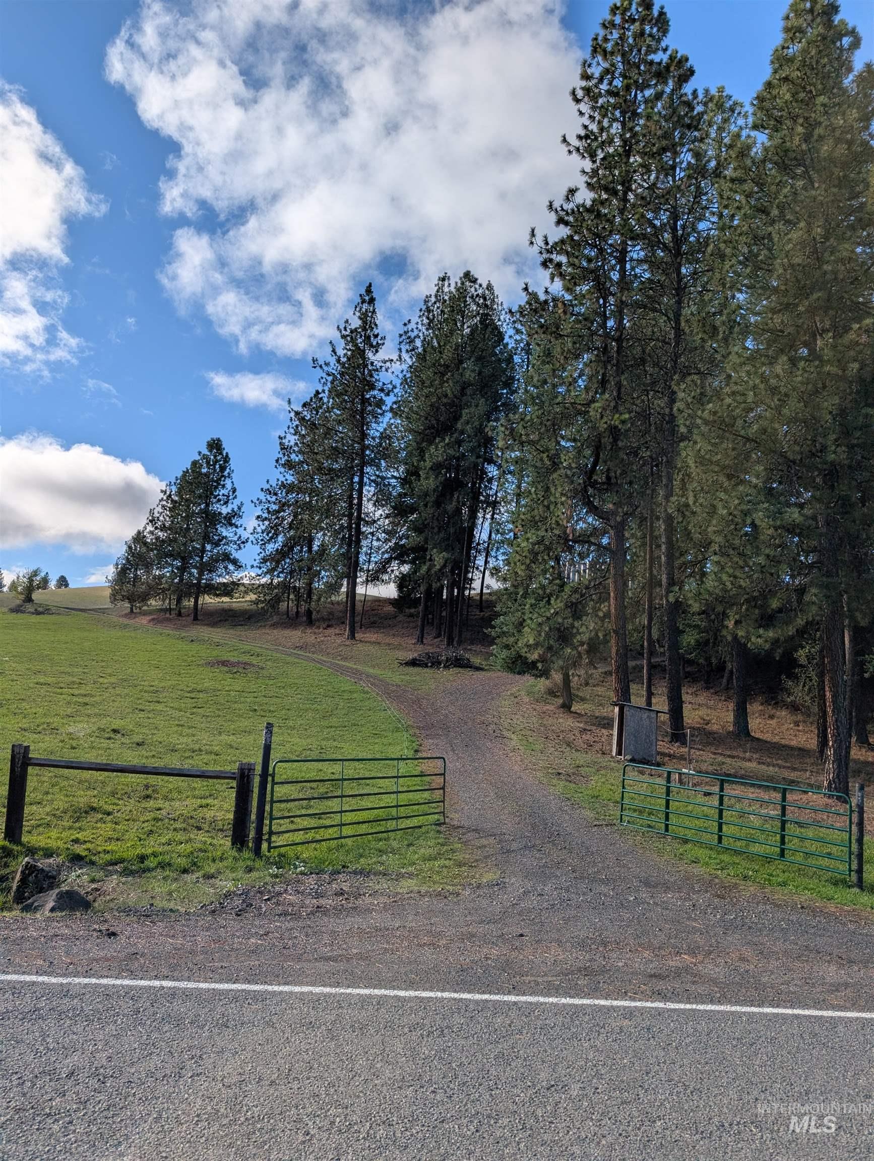 View of front facade featuring a view of rural / pastoral area and a gate